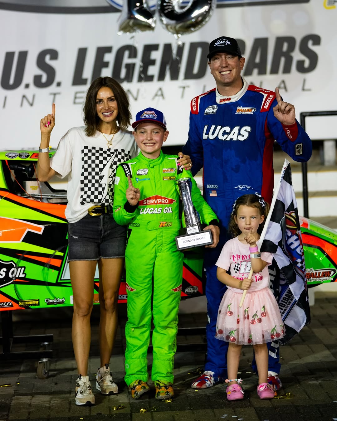 Samantha, Brexton, Kyle, and Lennix Busch posing for a photo at a race event, posted on May 18, 2026. | Source: Instagram/rowdybusch
