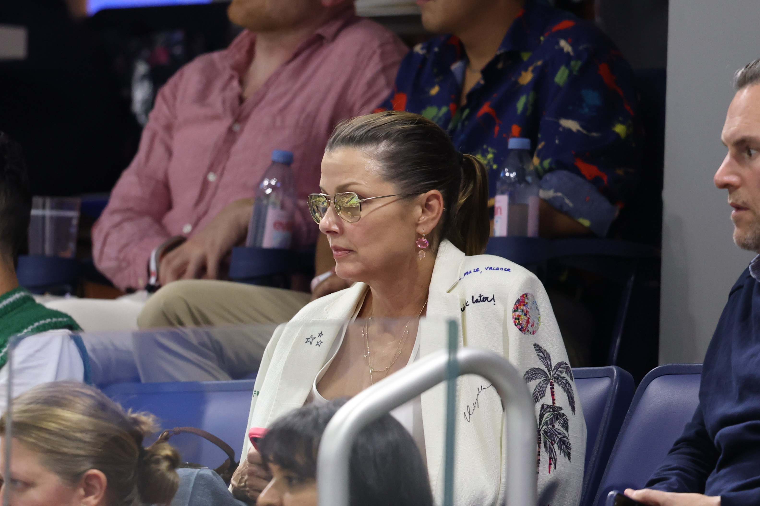 Bridget Moynahan watches the action from the stands during the 2026 US Open on August 30, 2026, in New York City, wearing sunglasses and her hair pulled back as she follows the match. | Source: Getty Images