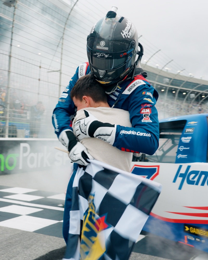 Brexton Busch giving his dad, Kyle Busch, a hug, posted on May 18, 2026. | Source: Instagram/rowdybusch