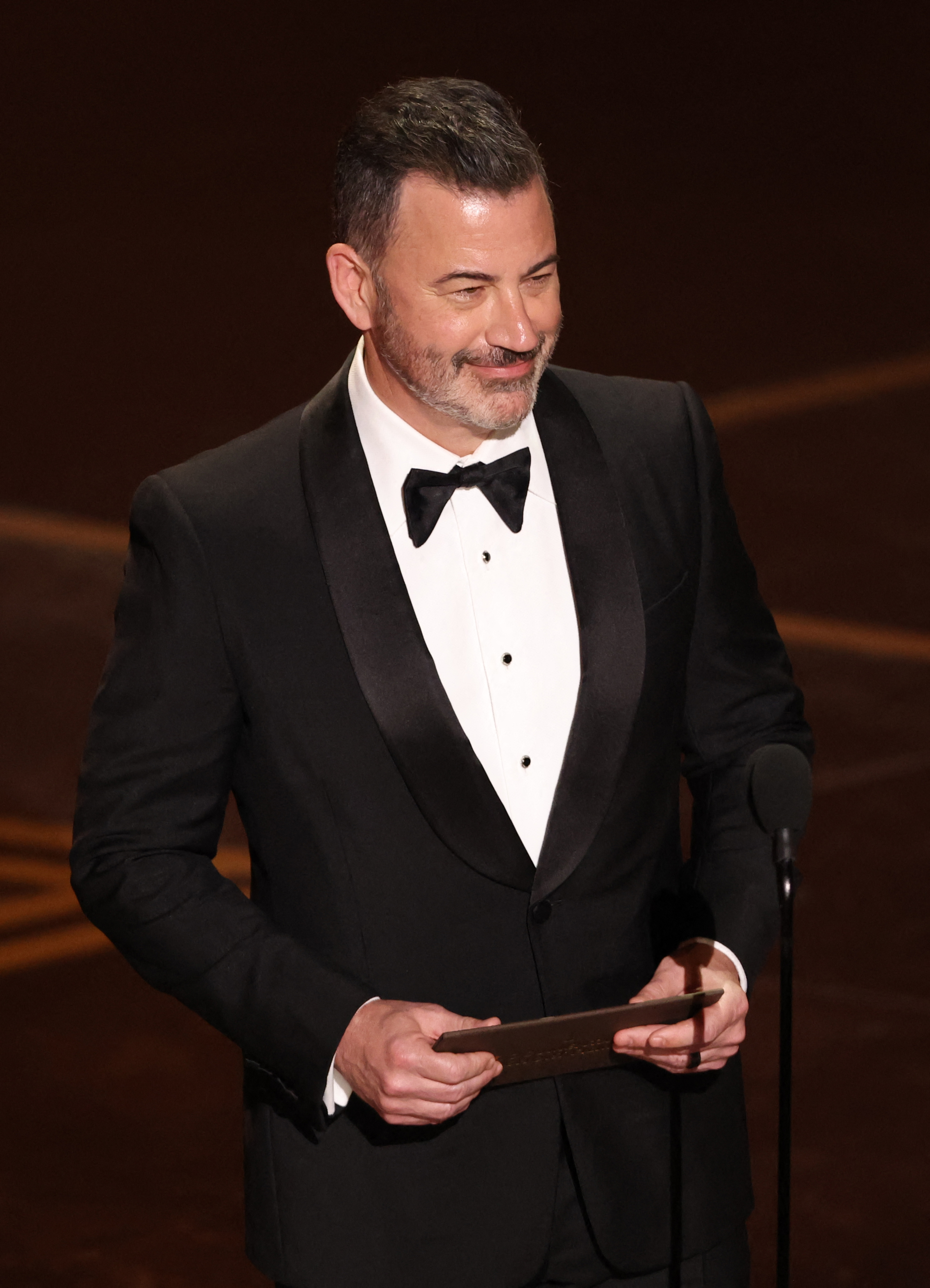 Jimmy Kimmel presents the award for Best Documentary Short Film onstage during the 98th Annual Academy Awards at the Dolby Theatre in Hollywood, California on March 15, 2026. | Source: Getty Images