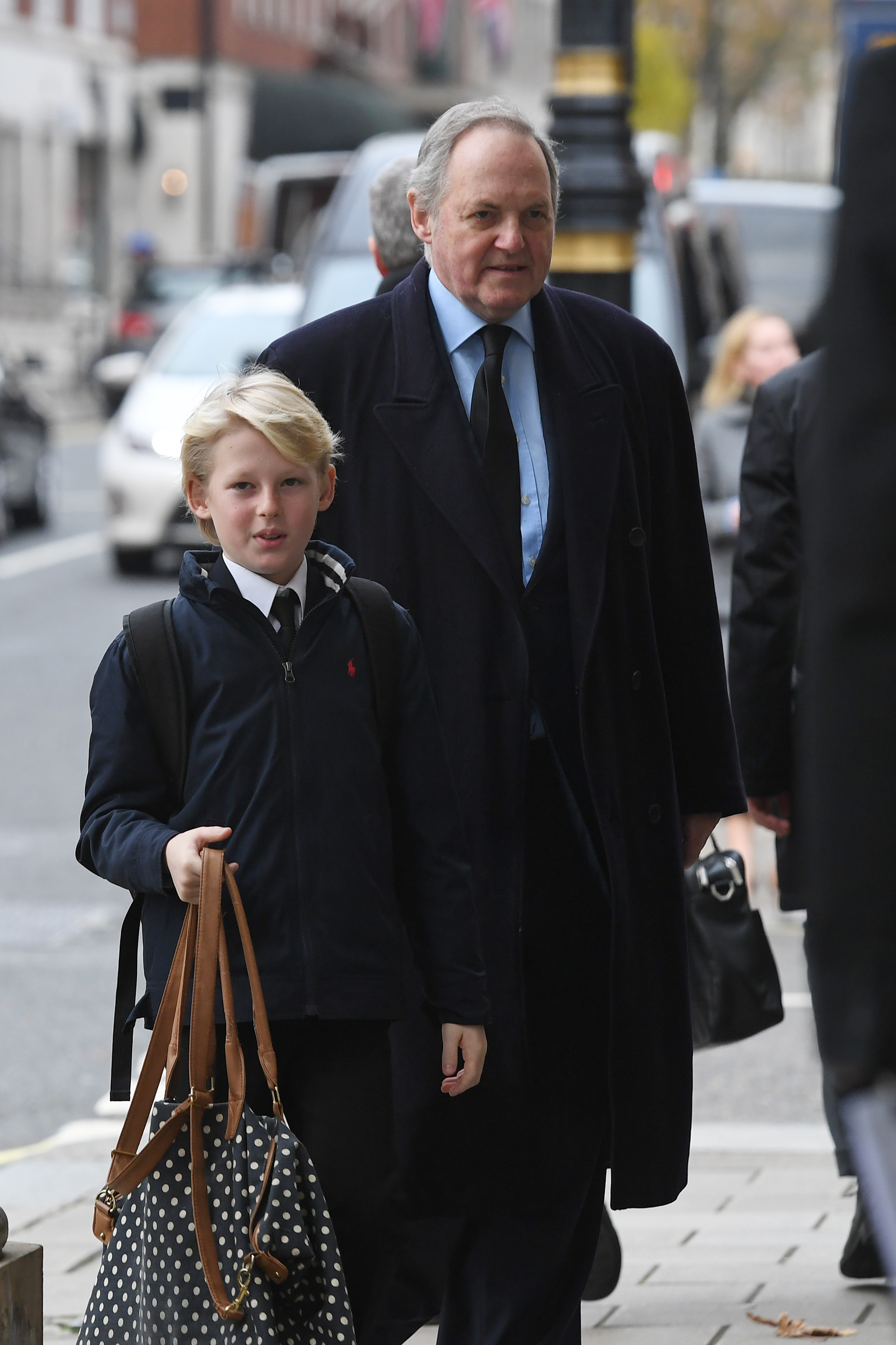 William Legge and an unidentified child at the memorial service for William's mother. | Source: Getty Images