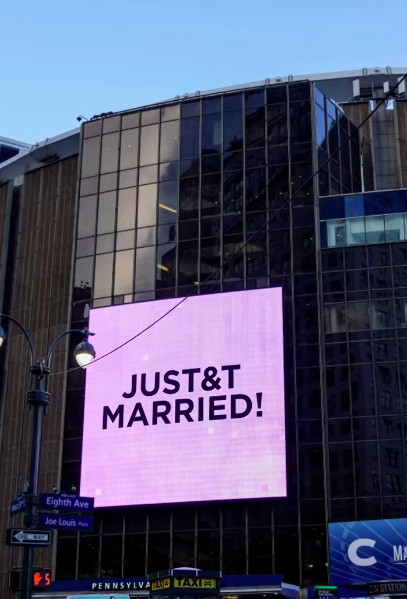 Madison Square Garden's exterior carried one of the most public nods to Taylor Swift and Travis Kelce's wedding after days of intense secrecy around the event. The "JUST&T MARRIED!" message echoed the couple's T&T branding that appeared throughout the celebration. | Source: TikTok/dailymailau