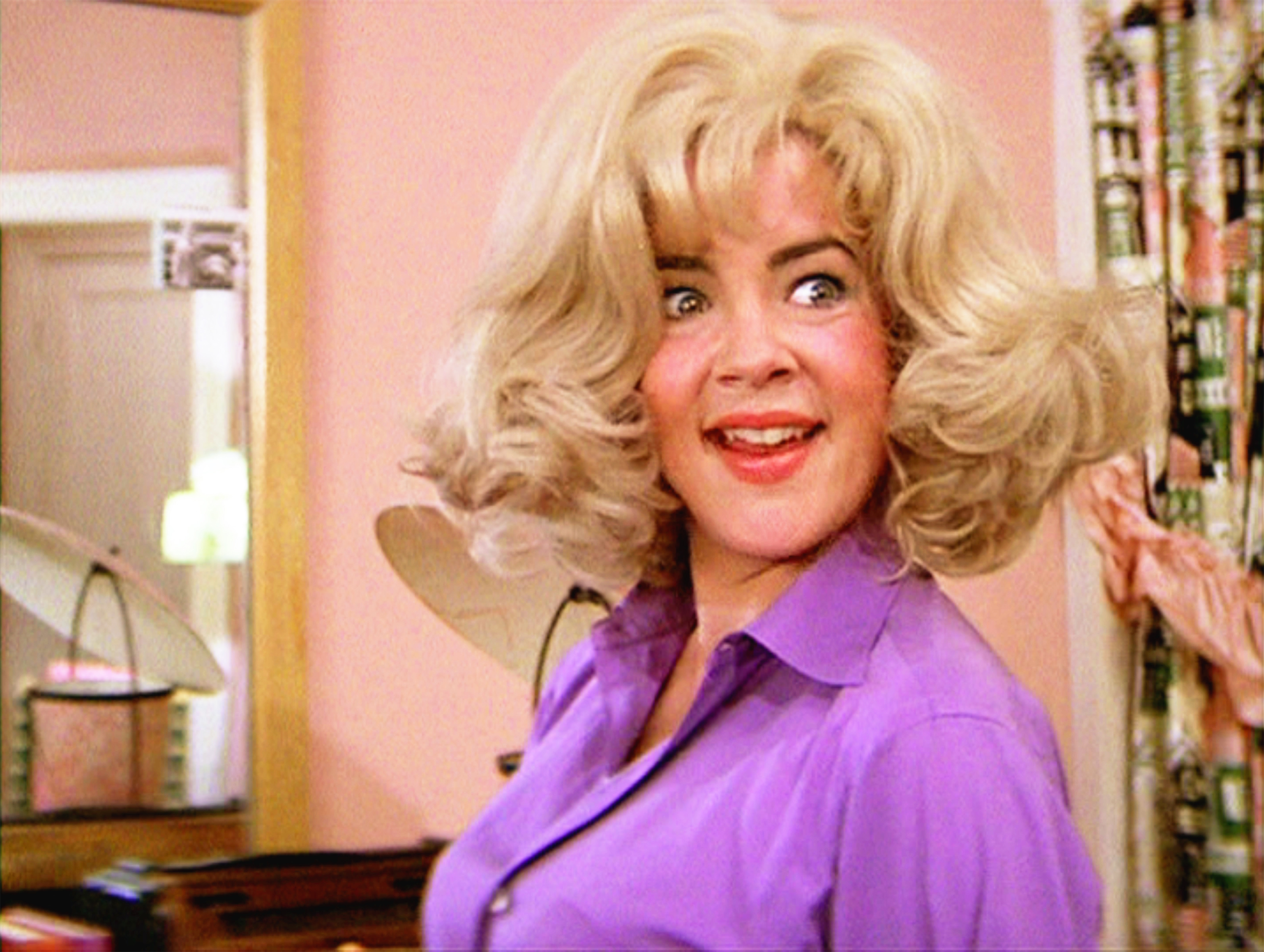 Channing appears as Rizzo during the famous slumber-party scene in Grease, wearing a blonde wig as she sings “Look at Me, I’m Sandra Dee.” The playful scene captured another side of the character, while Channing’s performance helped make Rizzo one of the movie’s most enduring personalities. | Source: Getty Images