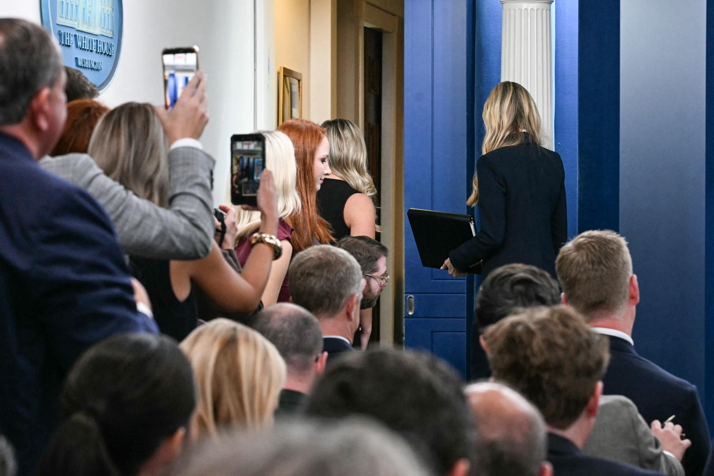 As Zacharia walked out of the briefing room, guests raised their phones to capture the moment — unaware that this would be her first and last appearance at the White House podium. | Source: Getty Images.