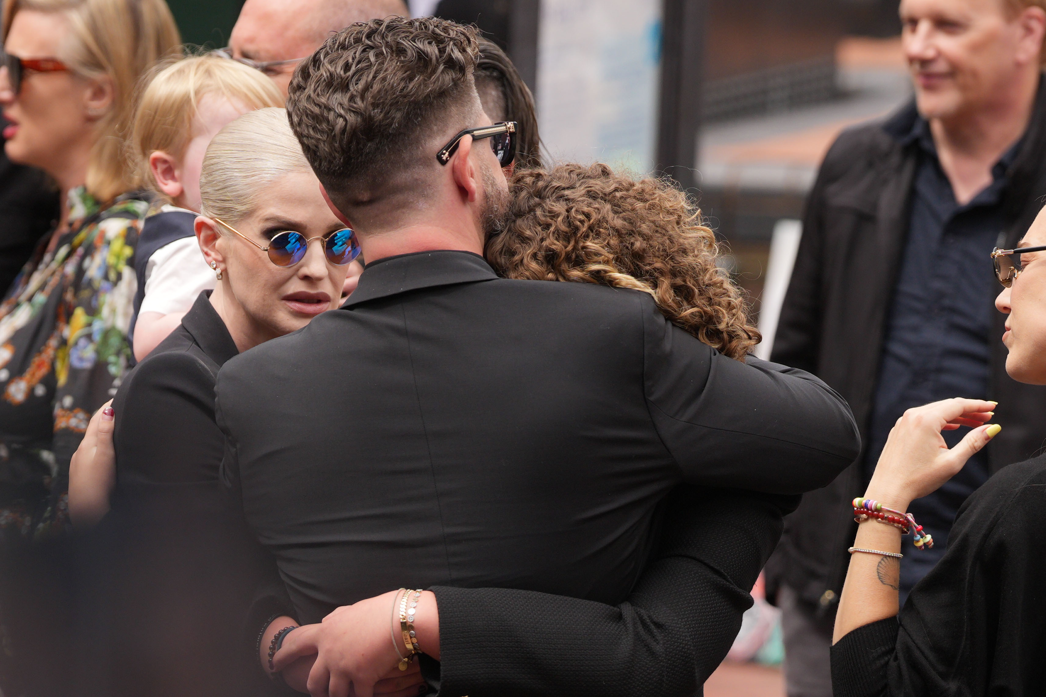 Kelly Osbourne gathered to mourn Ozzy in Birmingham in July 2025. Thousands of fans lined the streets to pay their final respects to the rock legend. | Source: Getty Images