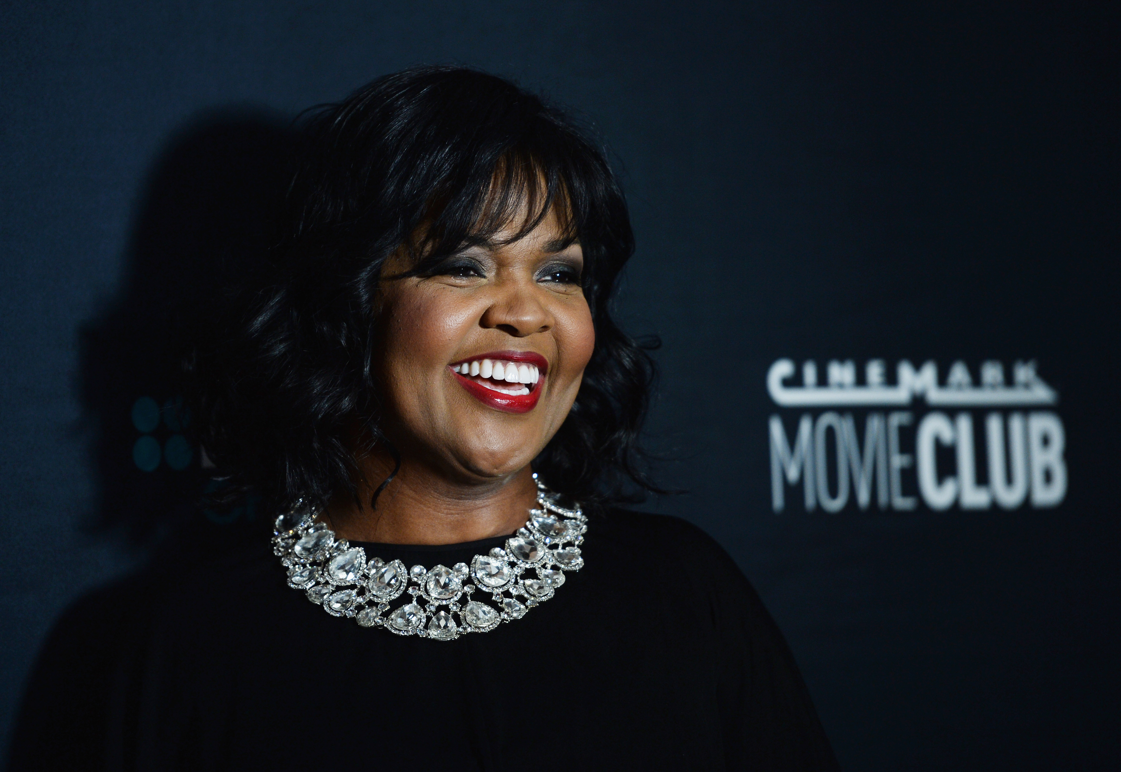 CeCe Winans smiles while posing on the red carpet during the 26th Annual Movieguide Awards Faith and Family Gala in Universal City, California, on February 2, 2018