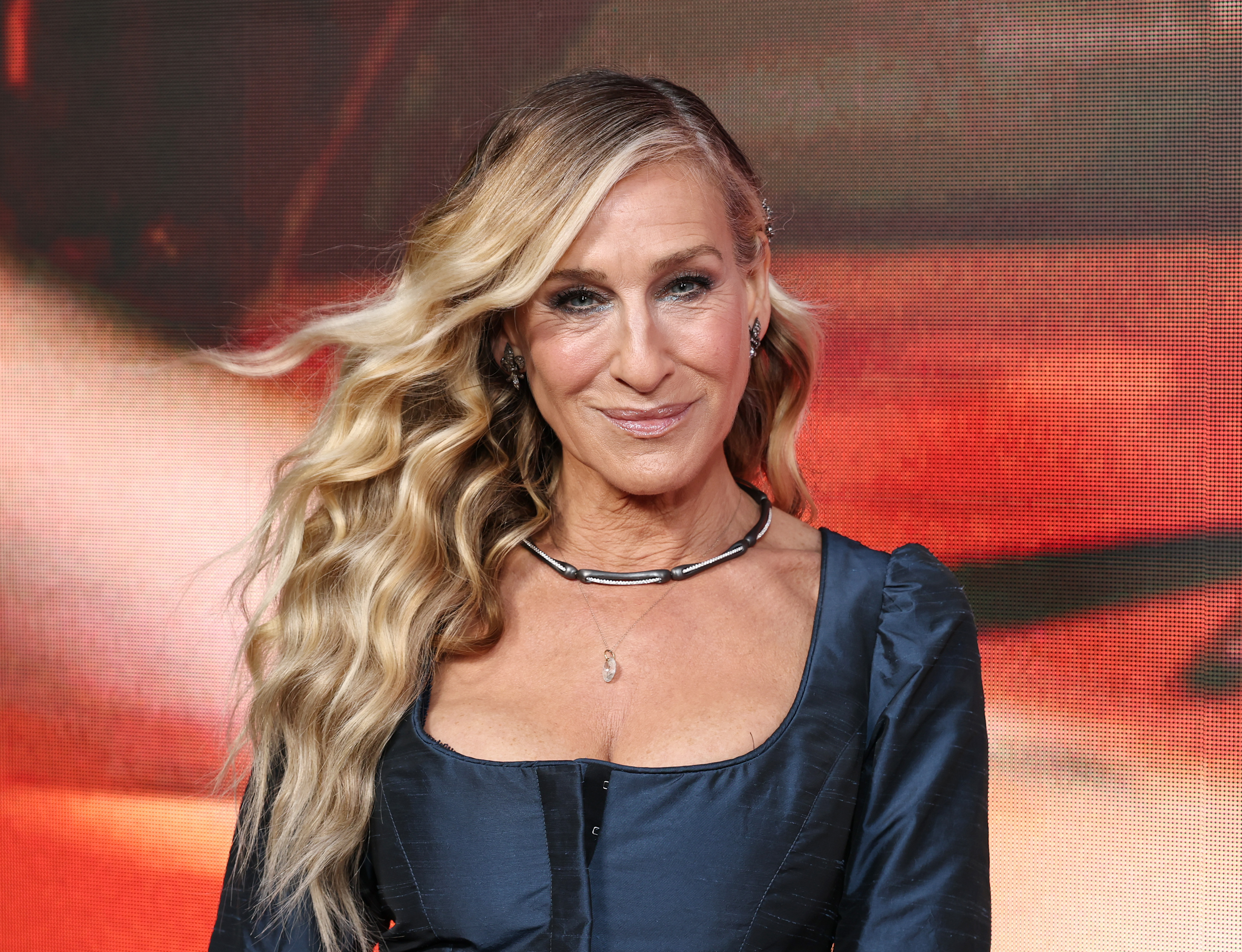 A sudden breeze gives Sarah Jessica Parker a windswept look that adds a touch of drama to the red carpet moment.
