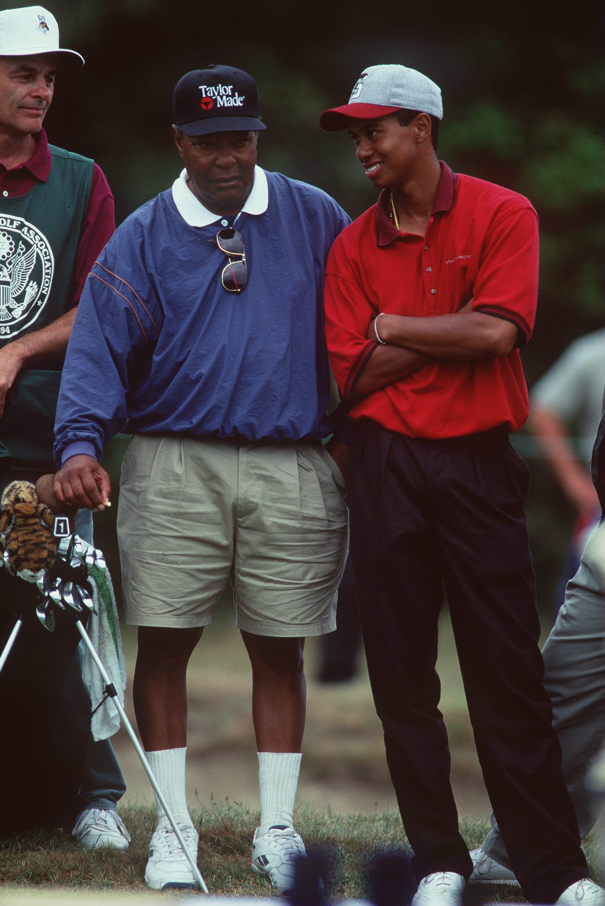 Tiger Woods shares a smile with Earl Woods during a round of competition in the U.S. Amateur Championships at the Newport Country Club on August 27, 1995, in Newport, Rhode Island | Source: Getty Images