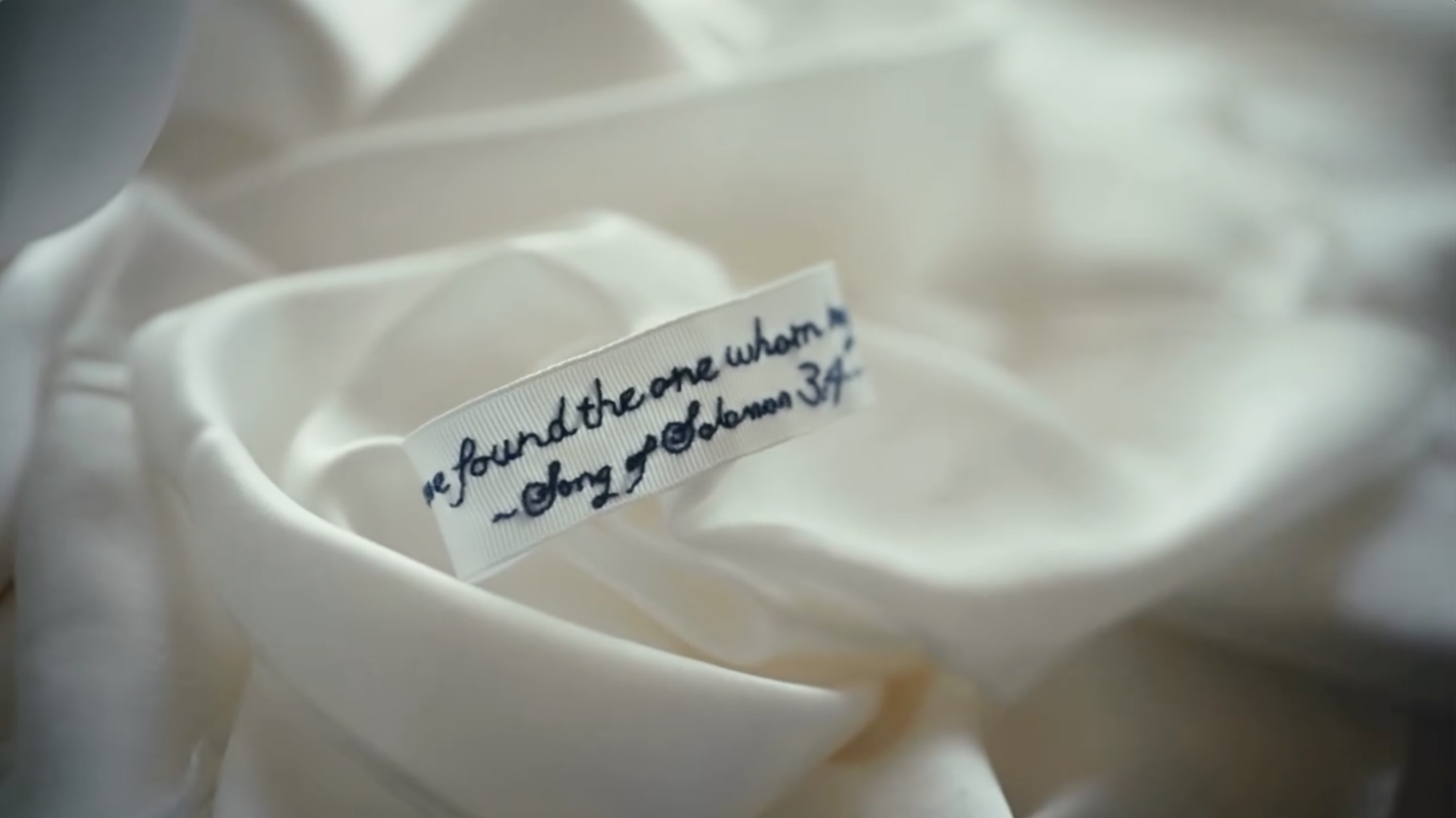 A handwritten Bible verse sewn into a garment offers a personal touch among the couple's wedding-day details. | Source: Instagram/donaldjtrumpjr