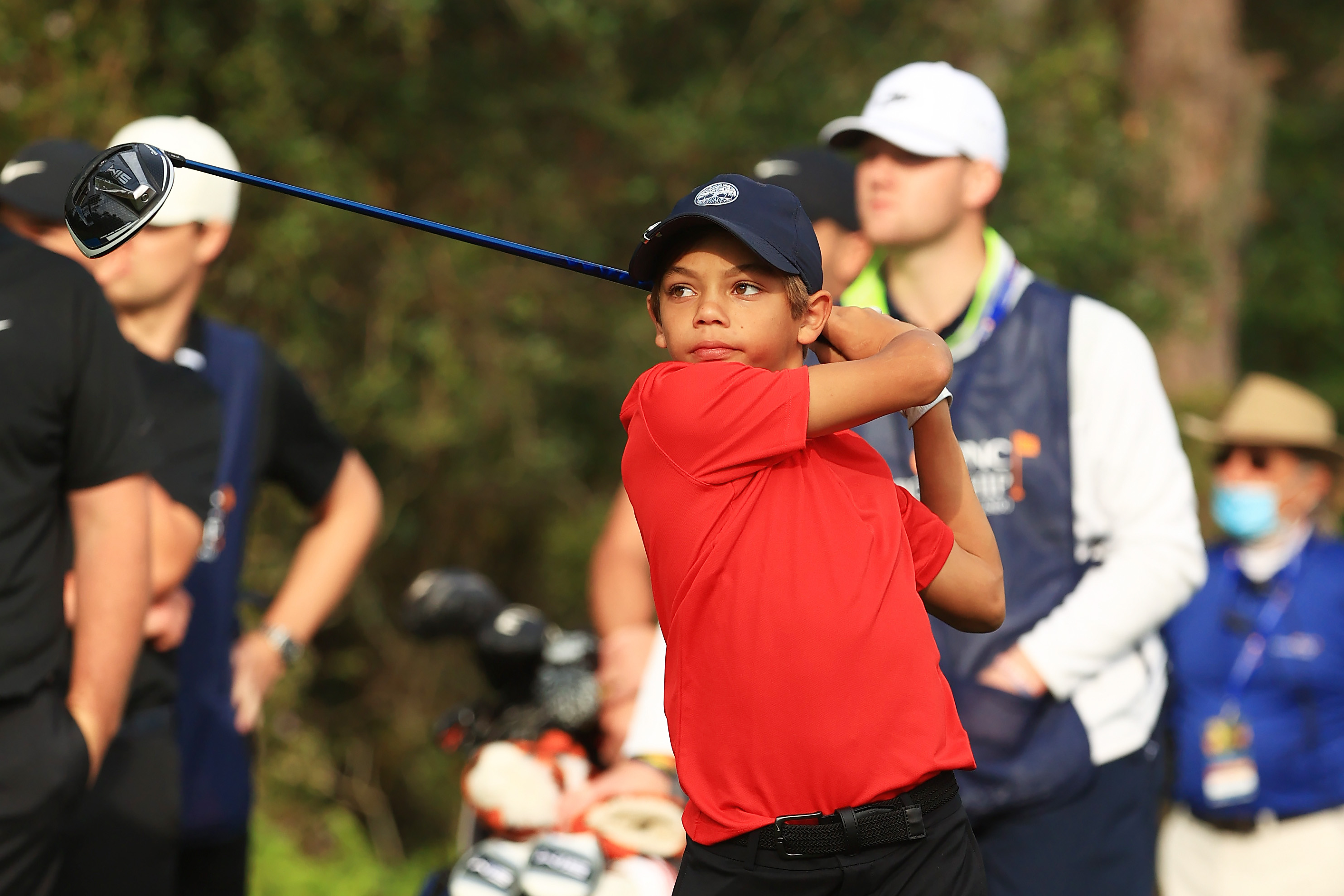 Charlie Woods plays a shot from the first tee during the final round of the PNC Championship at the Ritz-Carlton Golf Club Orlando on December 20, 2020, in Orlando, Florida | Source: Getty Images