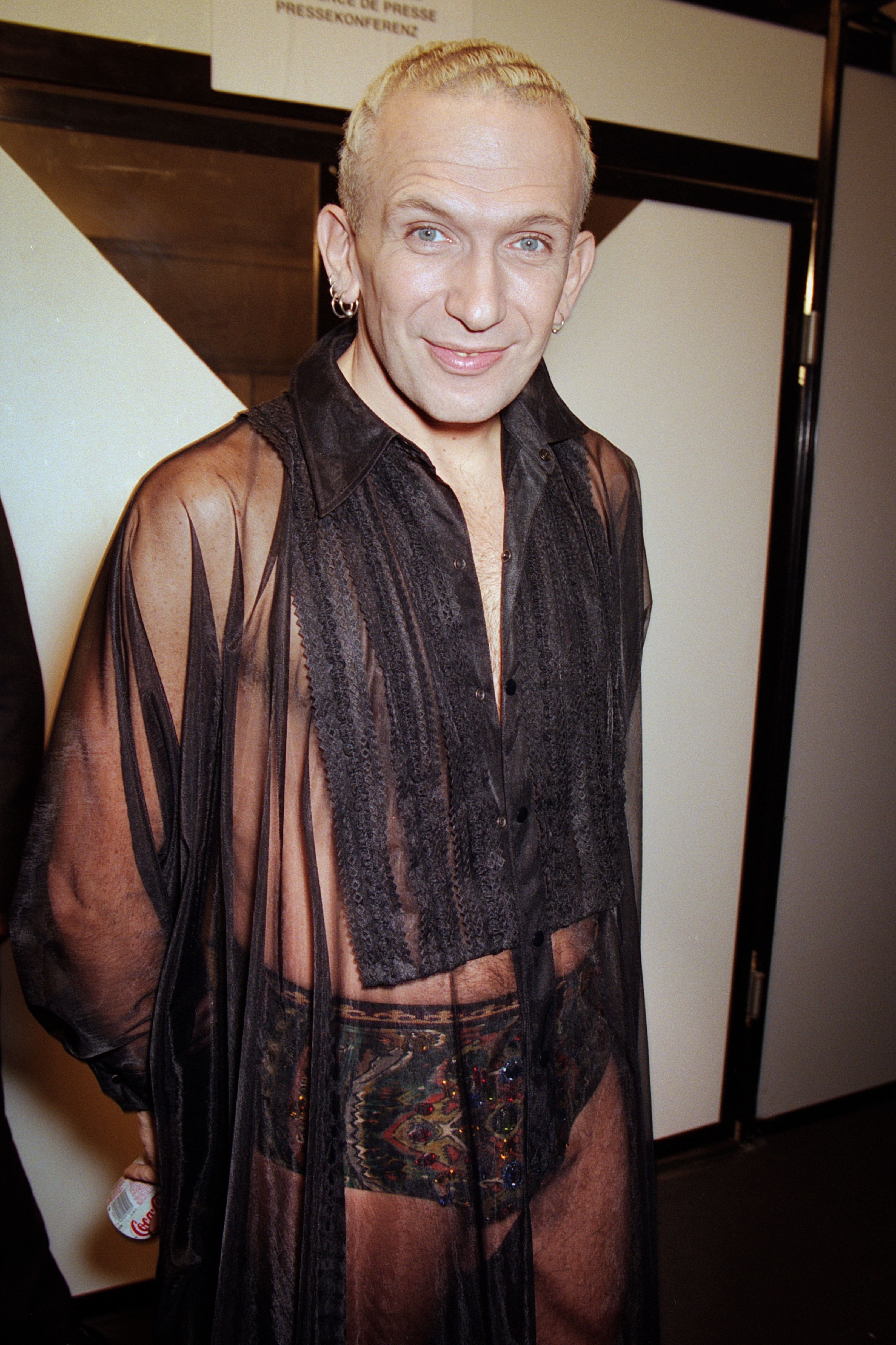 Fashion designer Jean Paul Gaultier arrives at the MTV Europe Music Awards (EMAs) in Paris, donning a sheer black outfit that showcased his avant-garde and boundary-pushing style.