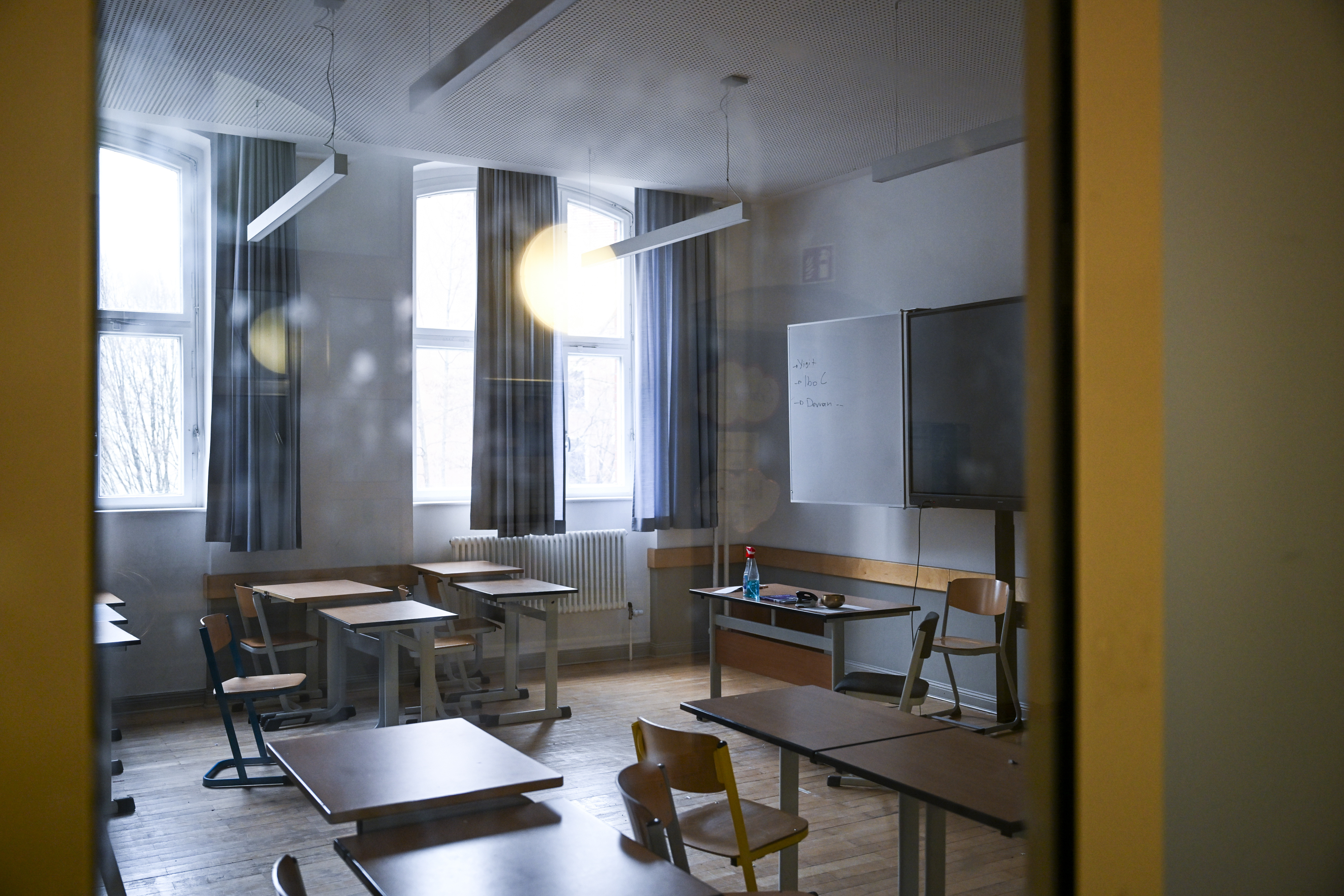 In 2020, classrooms preparing to welcome students back were fitted with car-shaped desks and Plexiglas dividers. | Source: Getty Images
