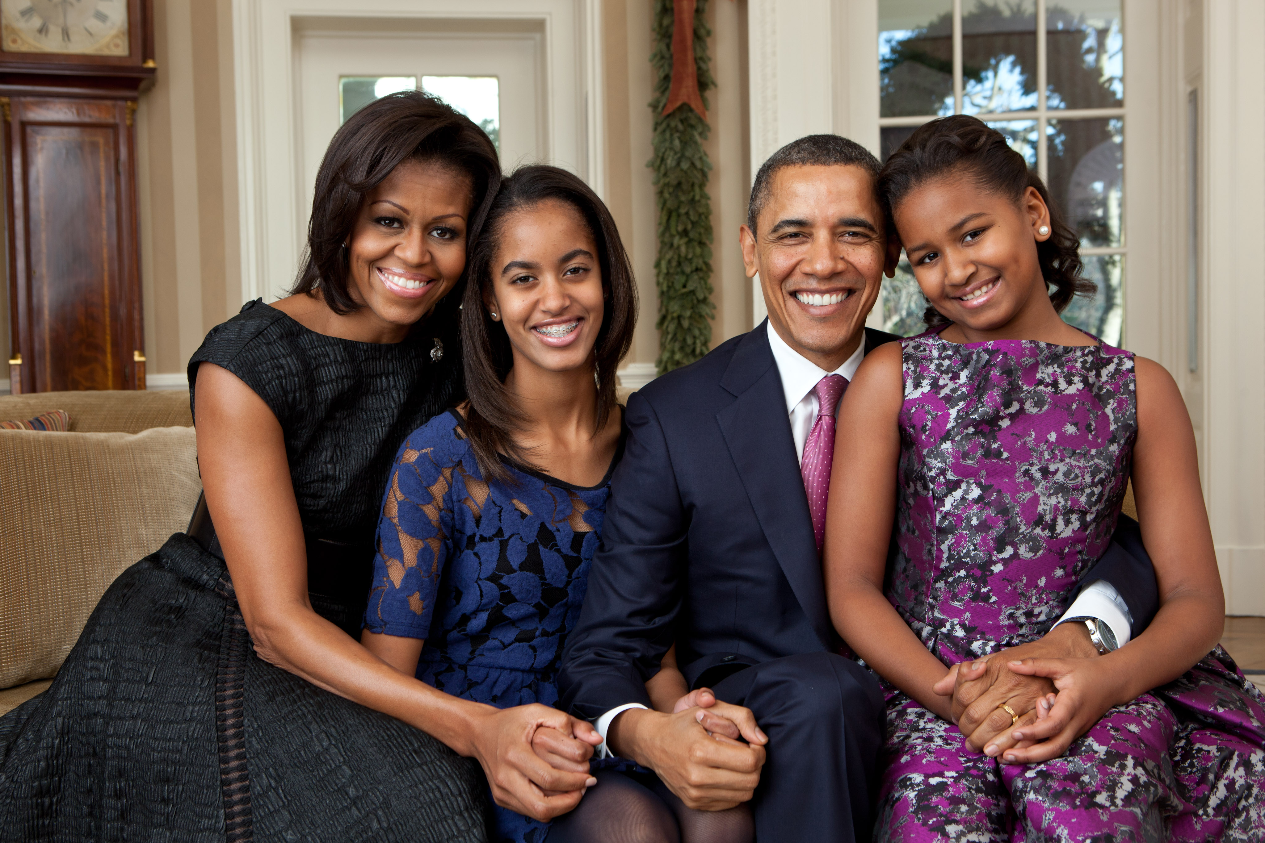 Barack and Michelle Obama pose with daughters Malia and Sasha during their White House years, when the family was adjusting to life with their growing household and a new four-legged addition. | Source: Getty Images