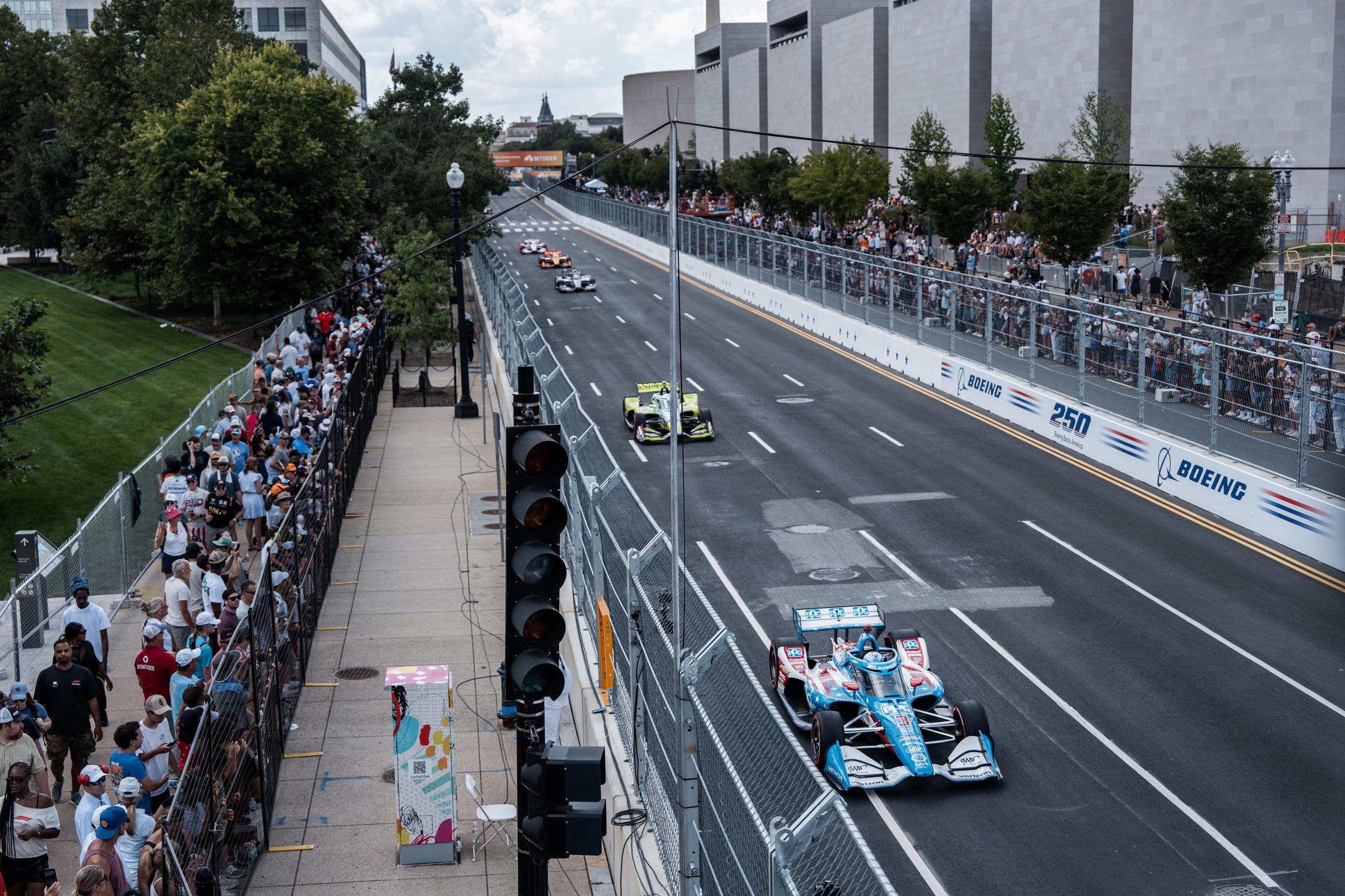 The president and first lady attended the high-profile event. In this photo, cars raced along Independence Avenue during the Freedom 250 Grand Prix on August 23, 2026, in Washington, D.C. | Source: Getty Images