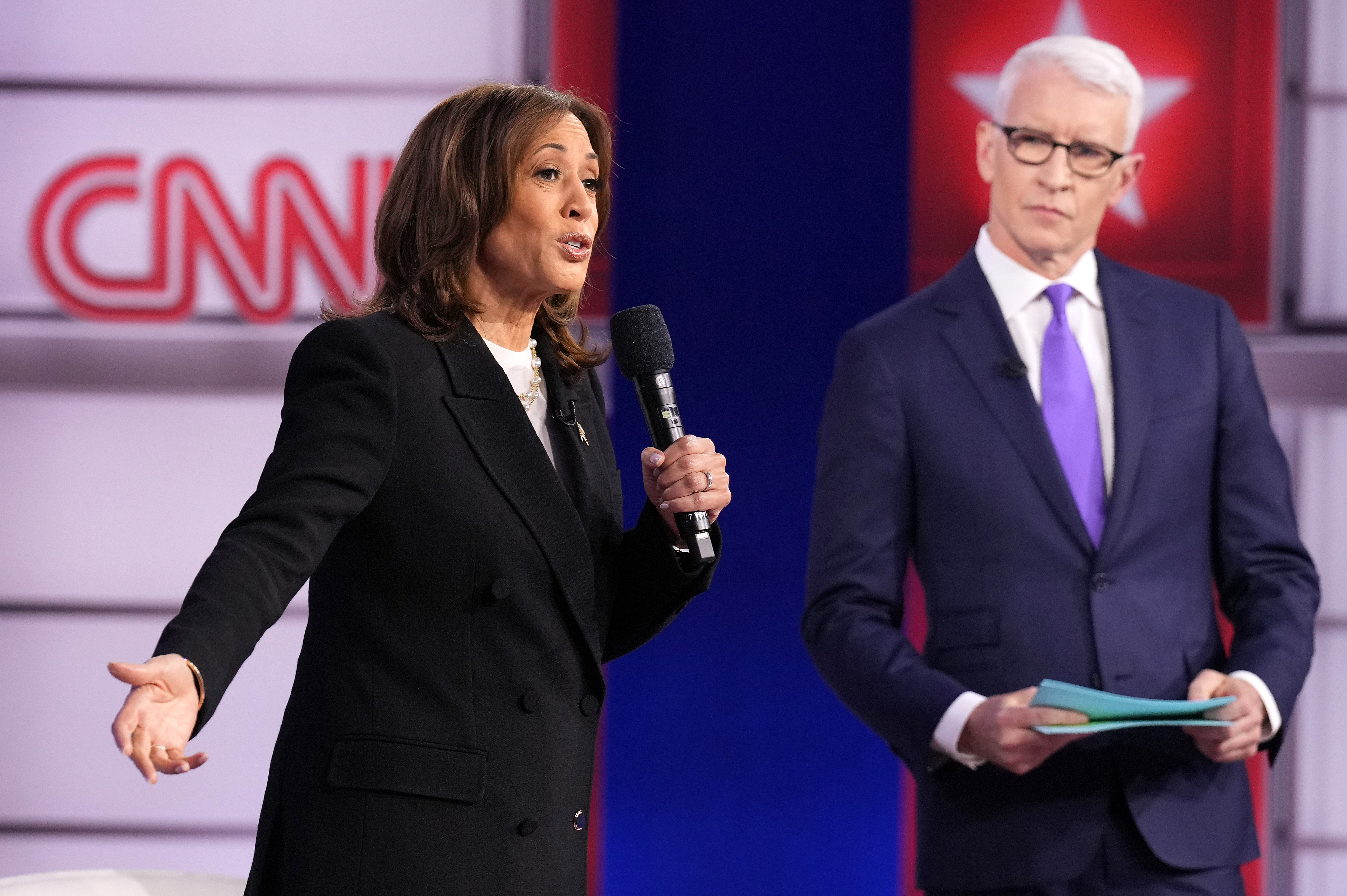 Kamala Harris talks with CNN moderator Anderson Cooper during a Presidential Town Hall event at Sun Center Studios in Aston, Pennsylvania, on October 23, 2024 | Source: Getty Images