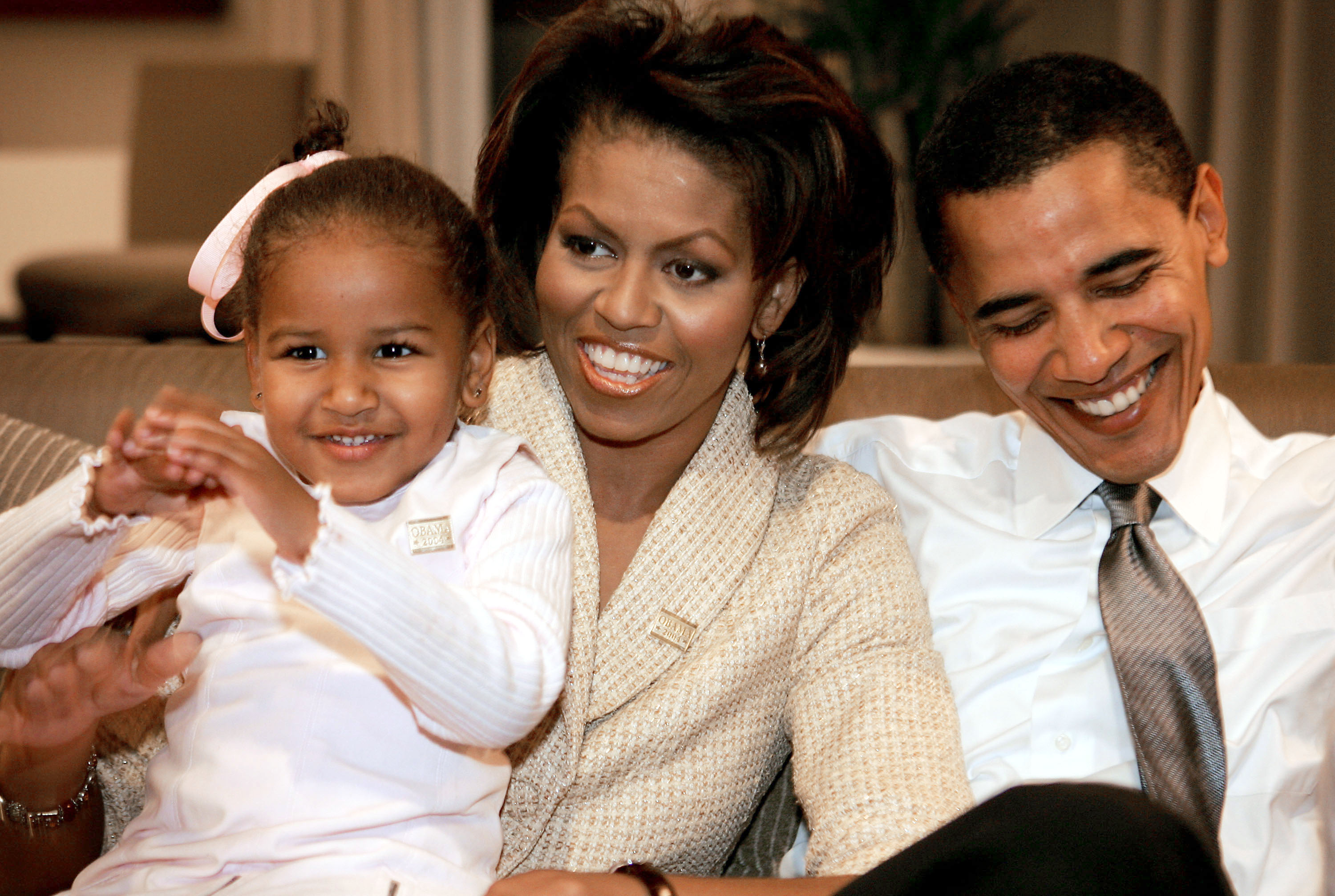 Sasha sits with her parents, Michelle and then-Senate candidate Barack Obama, as they await election results on November 2, 2004, in a Chicago hotel room. Obama is widely expected to win his race against Republican Alan Keyes.