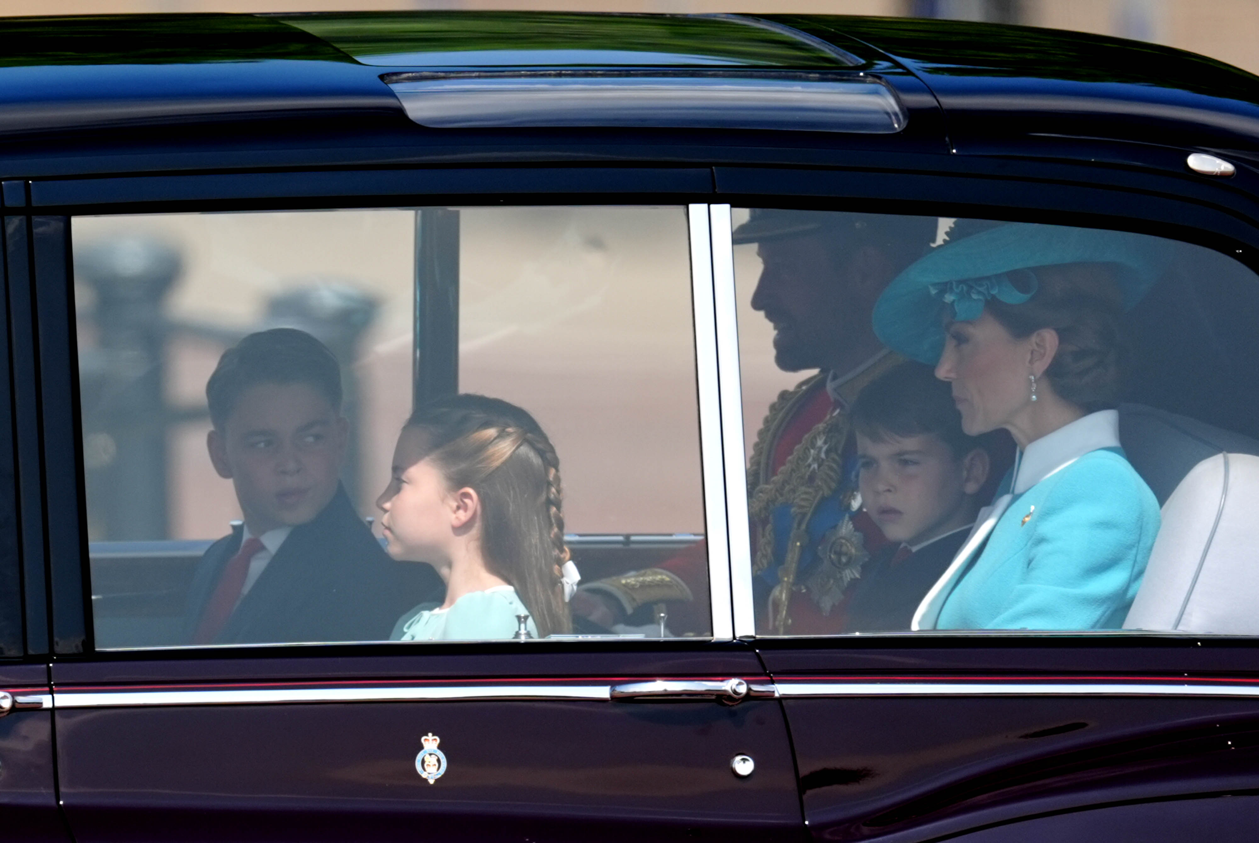 Prince William riding in a car with Prince George, Princess Charlotte, Prince Louis, and Princess Catherine. | Source: Getty Images