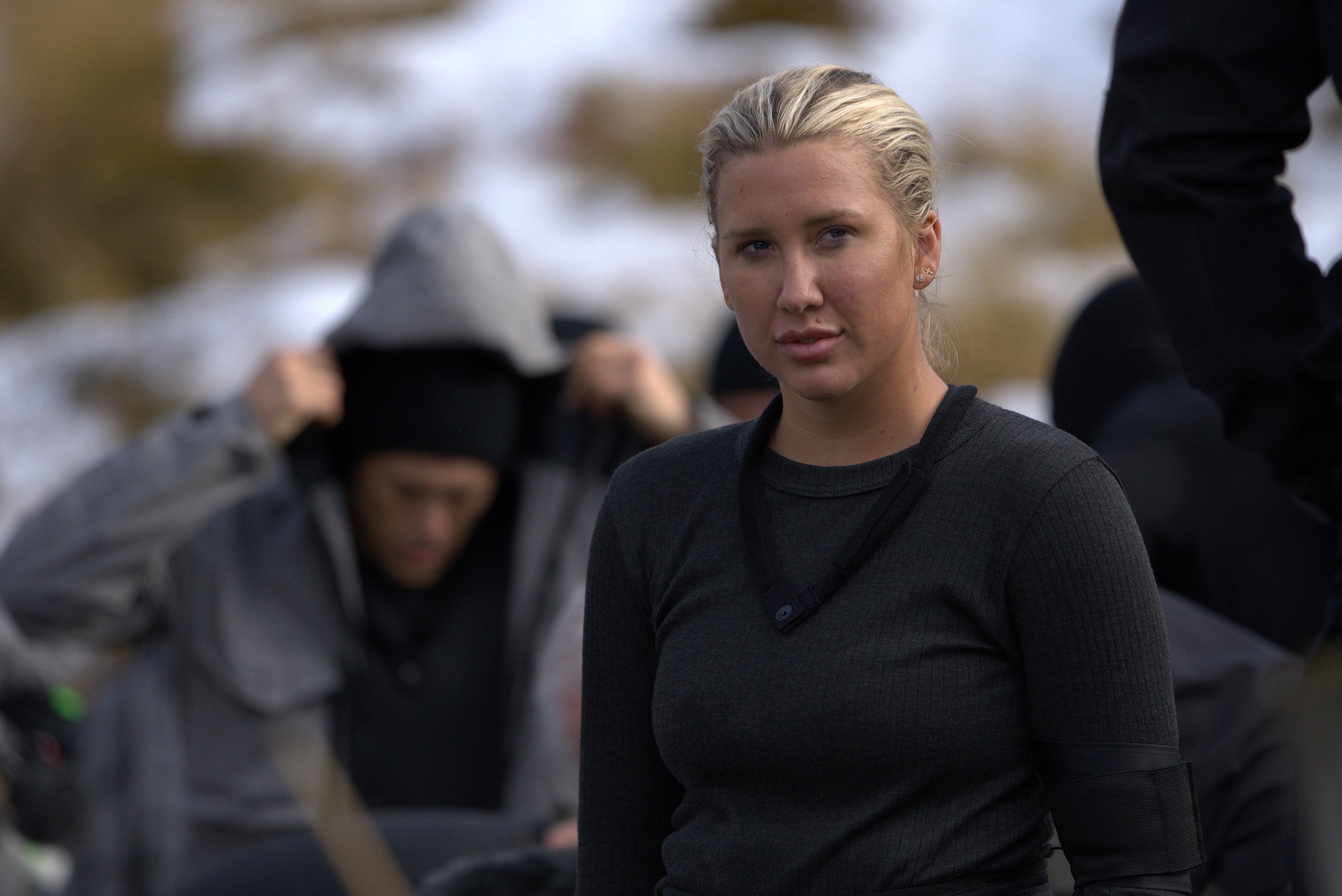 Savannah Chrisley appears in a scene from Season 2 of FOX's "Special Forces: World's Toughest Test," which aired on October 2, 2023, wearing a dark gray long-sleeved thermal base layer with an arm band and her blonde hair pulled back into a sleek low ponytail. | Source: Getty Images
