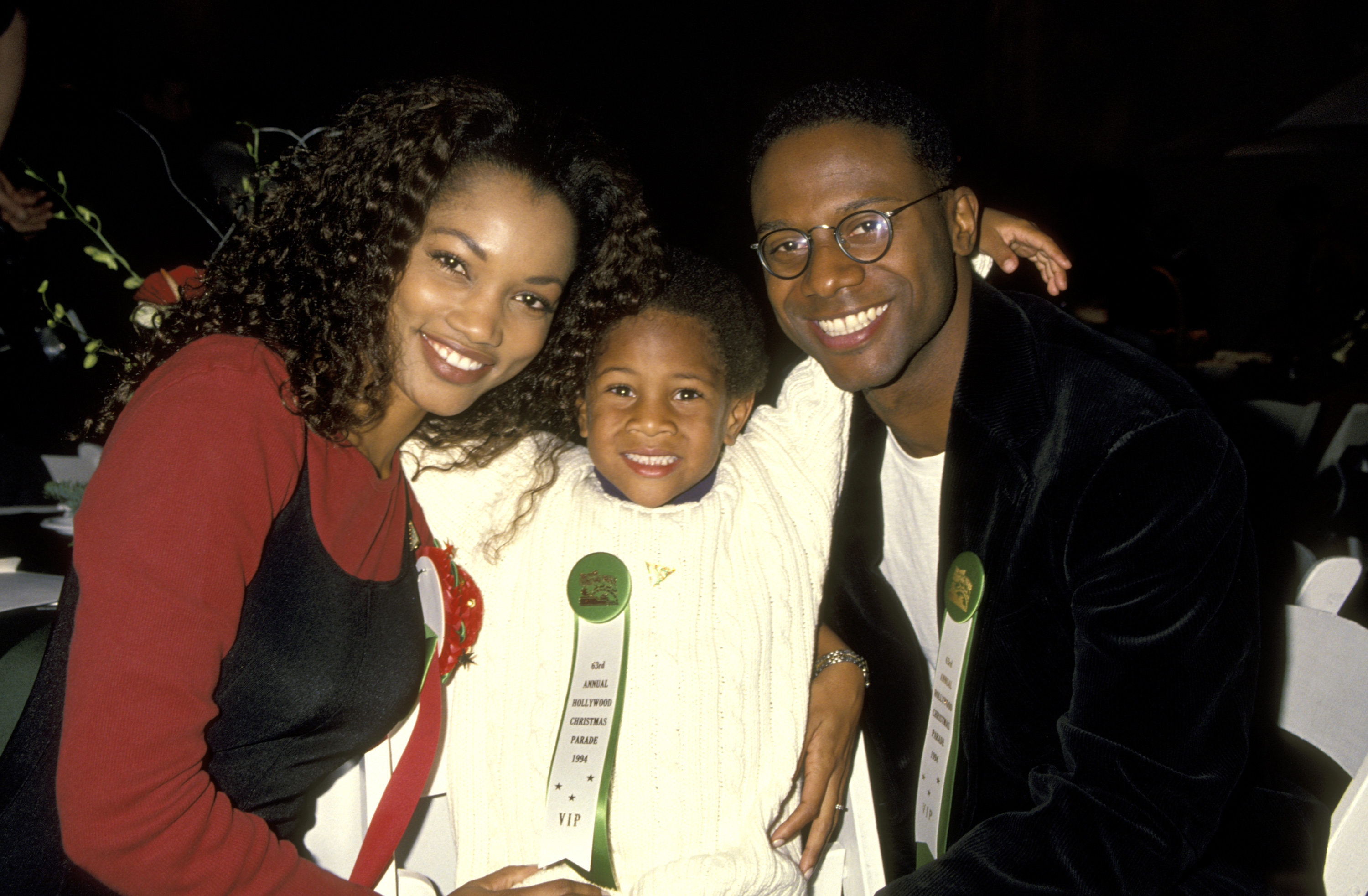 Garcelle Beauvais poses with husband Daniel Saunders and their young son Oliver Saunders at the Hollywood Christmas Parade in 1994 | Source: Getty Images