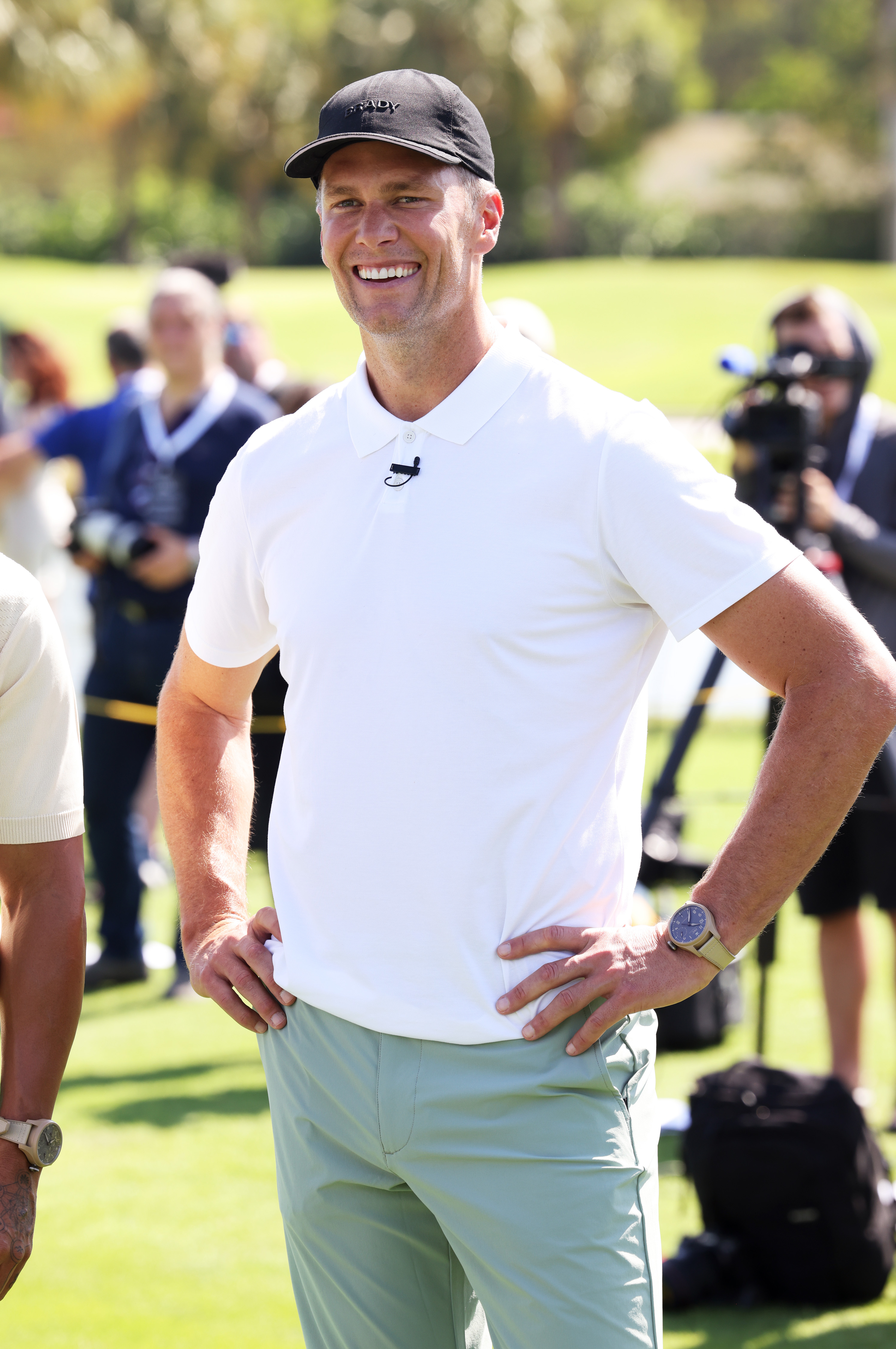 Always beaming with a smile and hands resting on his waist, Tom Brady brings his signature charm to The Big Pilot Challenge, a lively charity golf event hosted by IWC Schaffhausen at the Miami Beach Golf Club in Miami Beach, Florida.