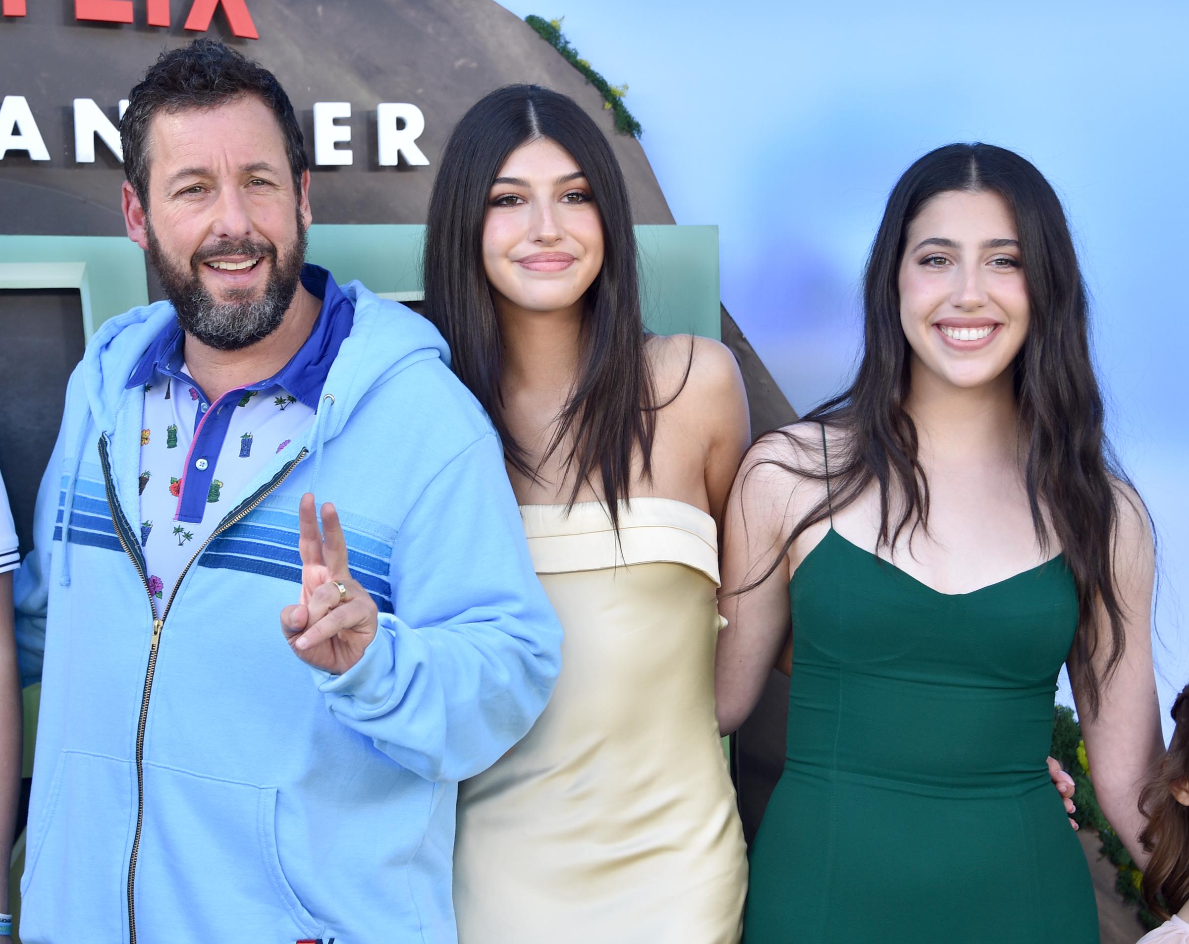 Adam Sandler poses with daughters Sunny and Sadie at the 2023 premiere of "Leo," another project that brought the actor and his children together professionally. | Source: Getty Images