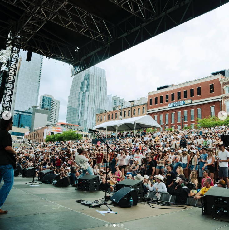 Conner Smith performs for a large crowd at the Chevy Riverfront Stage during CMA Fest in Nashville | Source: Instagram/connersmithmusic