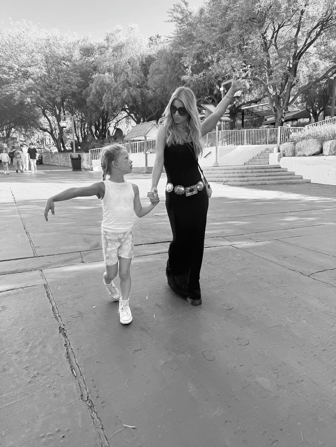 Jessica Simpson and her daughter, Birdie Mae Johnson, walking while holding hands at Six Flags, from a post dated July 1, 2025 | Source: Instagram/jessicasimpson