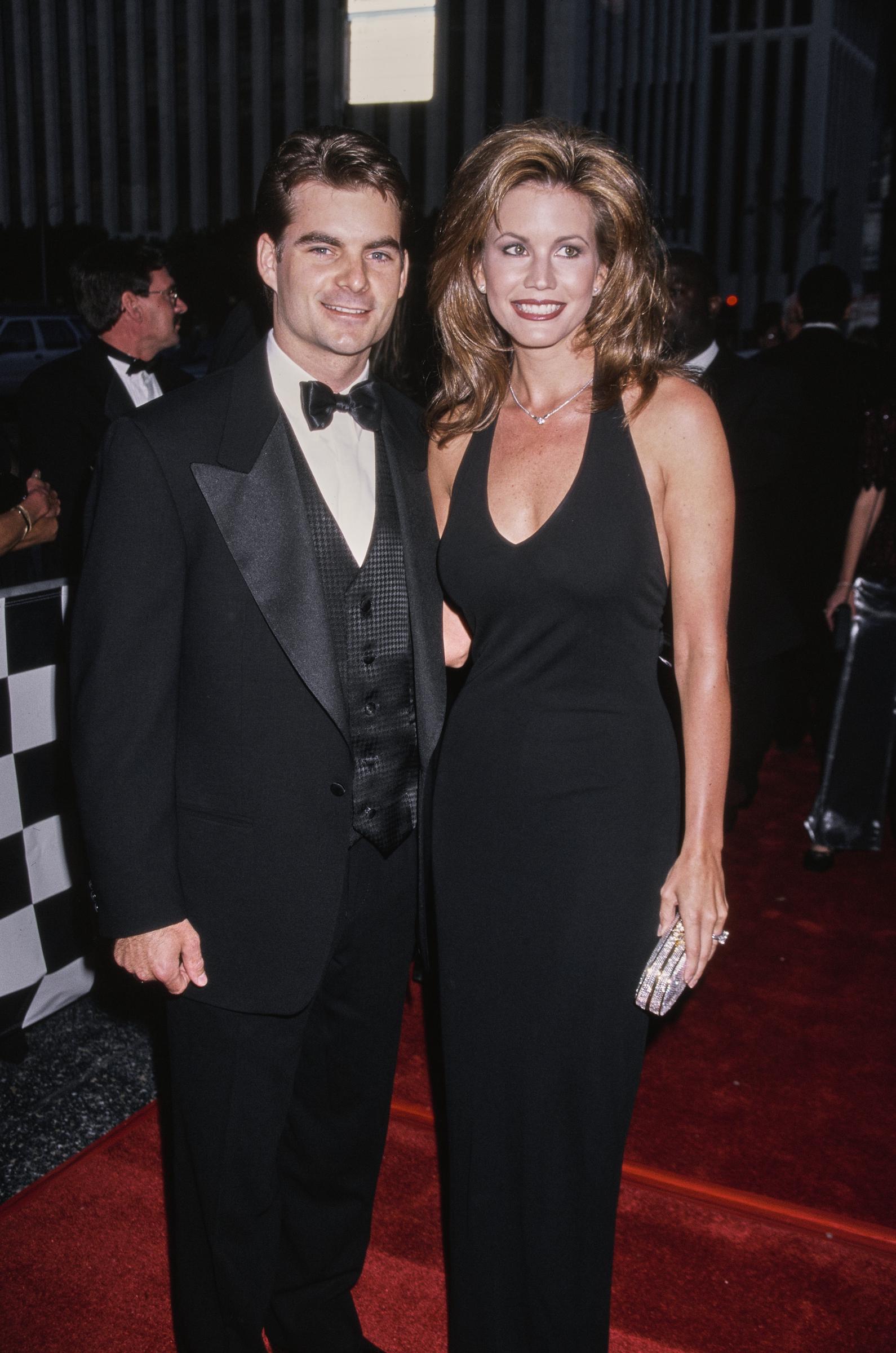 Jeff Gordon and Brooke Sealey traded the racetrack for the red carpet as they arrived at "NASCAR's Night in Hollywood - A Golden Celebration" at the Wiltern Theatre in Los Angeles on May 1, 1998. Dressed in coordinating black for the event marking NASCAR's 50th anniversary, the married couple posed together during another high-profile period in Gordon's career.