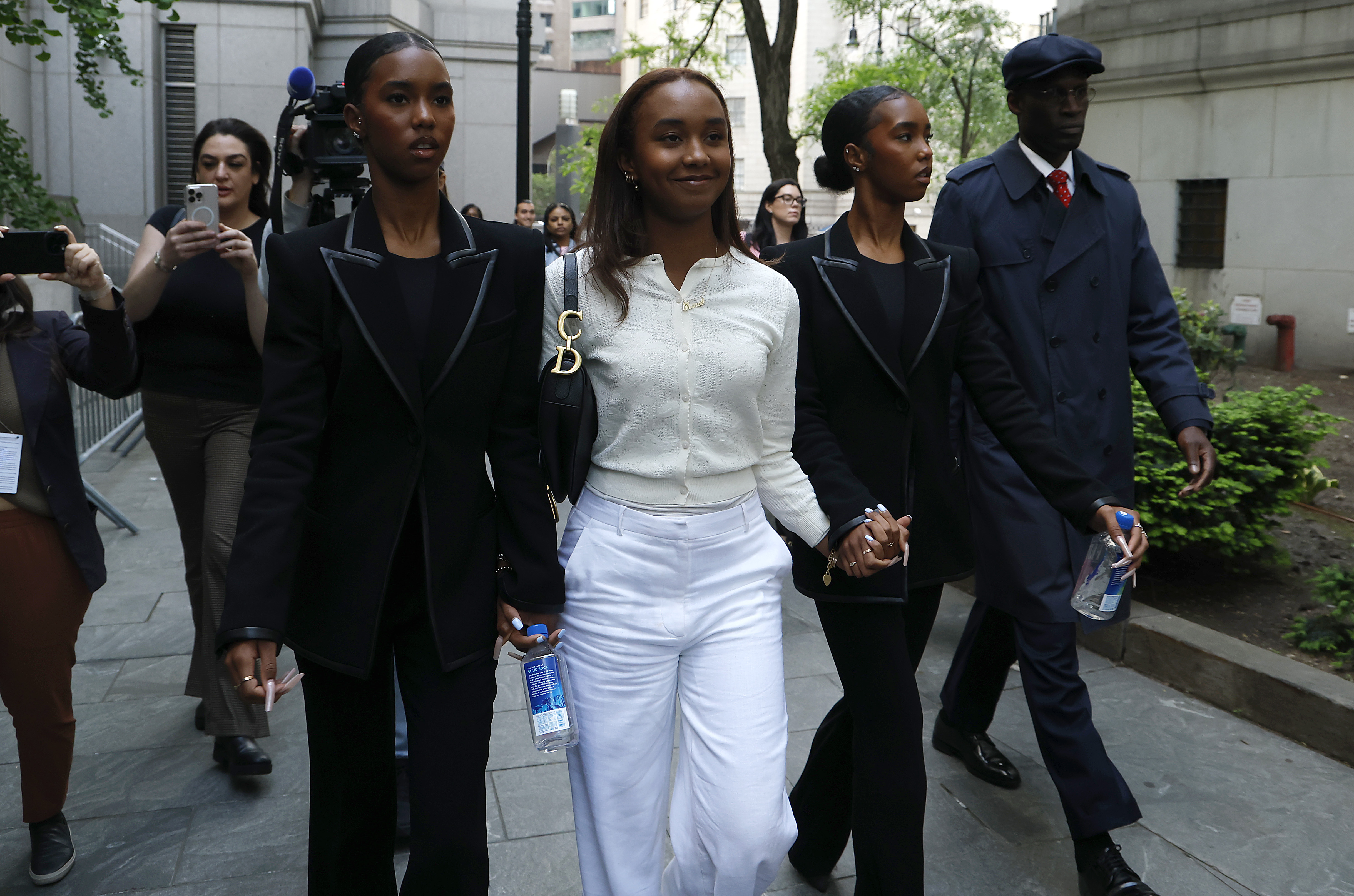 D'Lila, Chance, and Jessie Combs were photographed leaving Manhattan Federal Court following opening statements on May 12, 2025. | Source: Getty Images