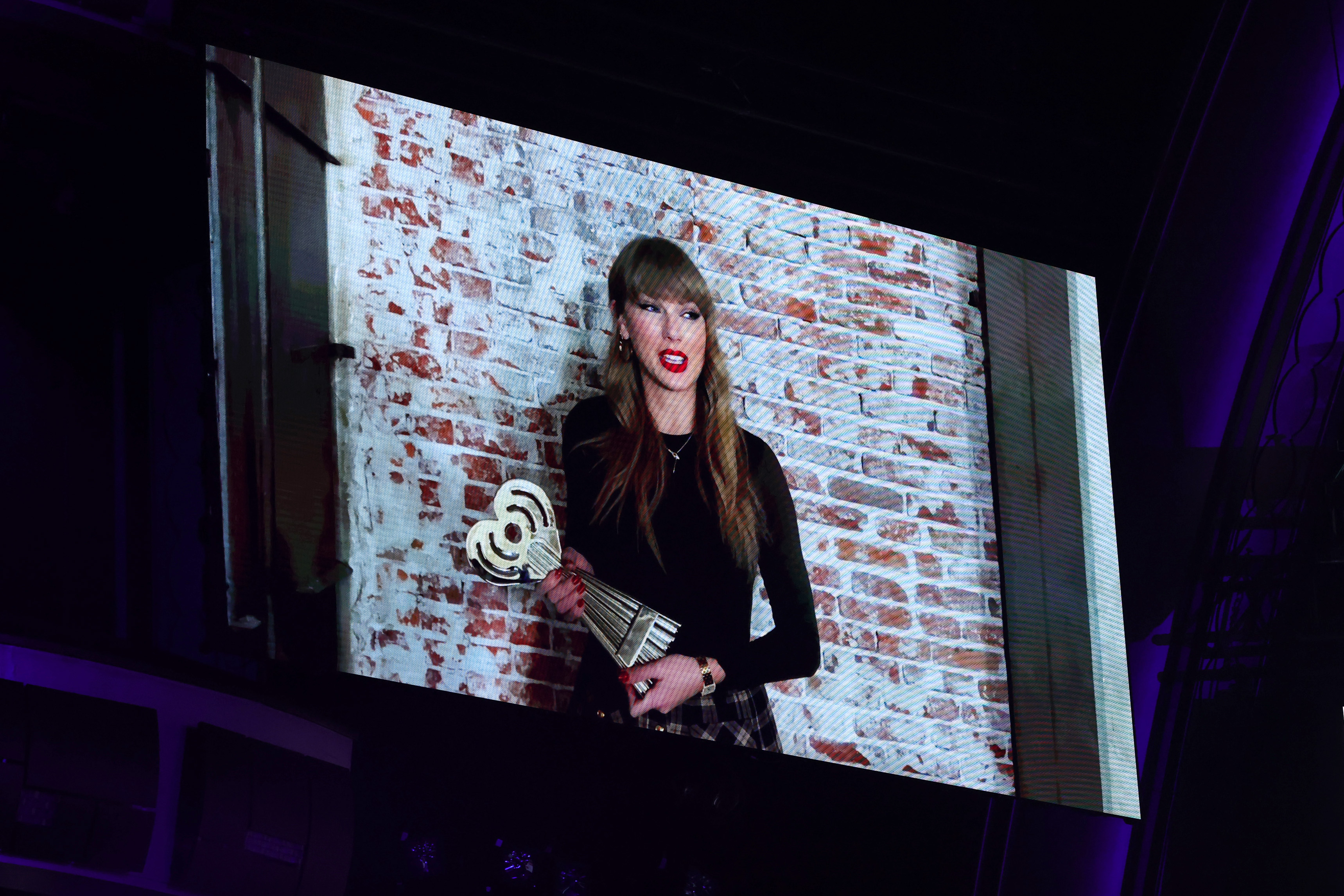 Taylor Swift accepts her awards via video at the 2025 iHeartRadio Music Awards at Dolby Theatre on March 17, 2025, in Los Angeles, California. | Source: Getty Images