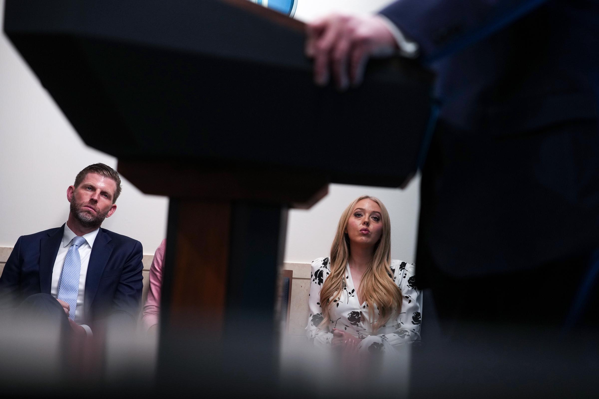 Eric Trump and Tiffany Trump watch as U.S. President Donald Trump speaks during a news conference in the James S. Brady Press Briefing Room of the White House on April 6, 2026, in Washington, DC | Source: Getty Images