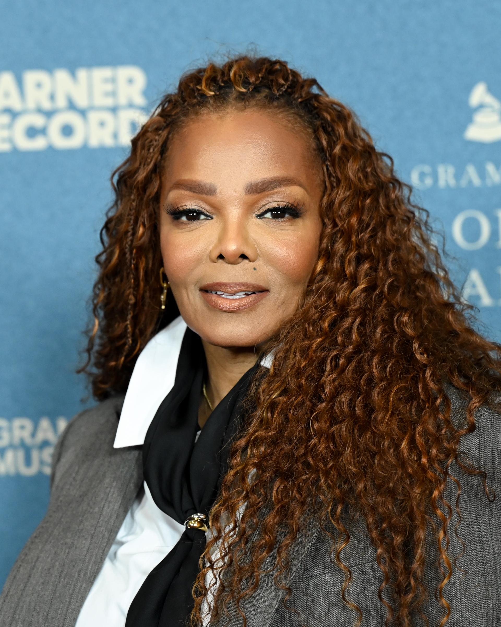 Janet Jackson shows off her bouncy curls and fresh, youthful look.