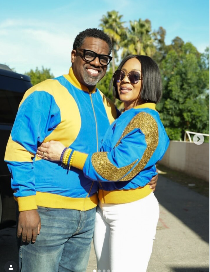 Erica Campbell and Warryn Campbell posing together in coordinated blue-and-yellow outfits during a sunny outing. | Source: Instagram/imericacampbell