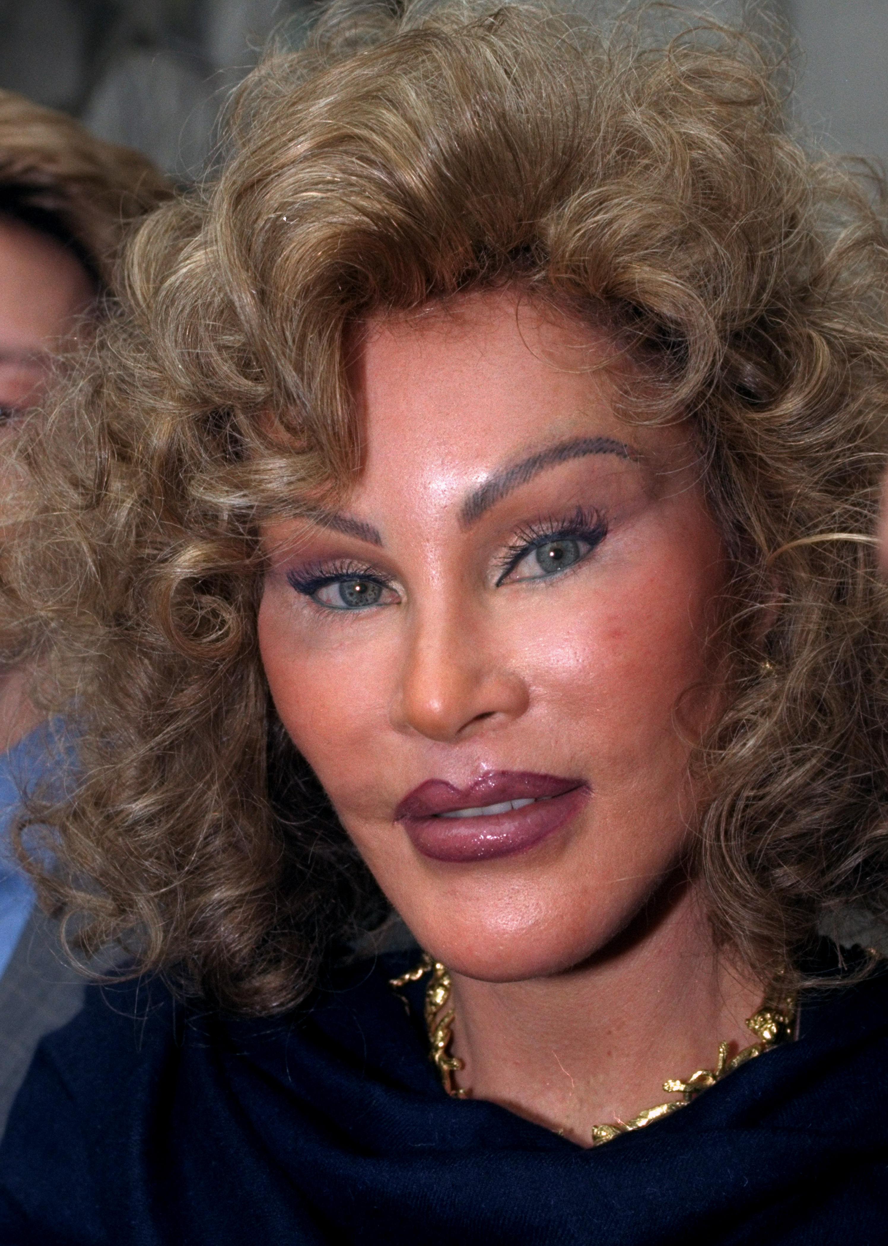 Jocelyne Wildenstein leaving State Supreme Court in Lower Manhattan with her lawyers and friends on April 21, 1999. | Source: Getty Images