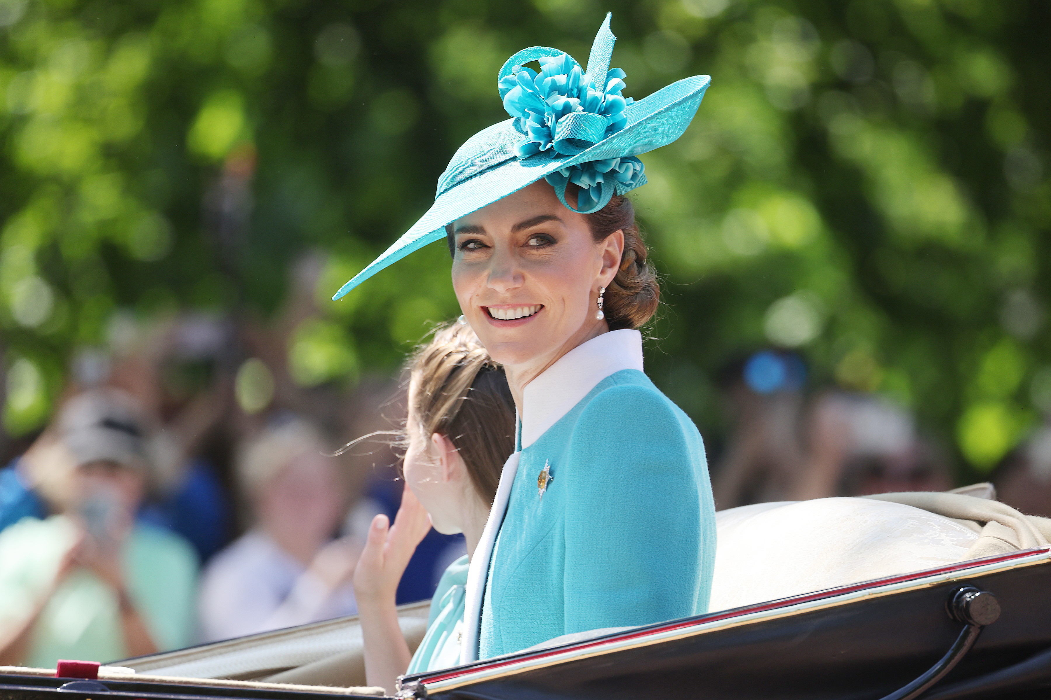 Princess Catherine shares a radiant smile with the crowd as she stands beside Princess Charlotte during the 2025 Trooping the Colour in London. The mother-daughter duo captures a moment of grace and poise amid the royal spectacle, with Catherine’s composed warmth echoing through the cheering crowd.
