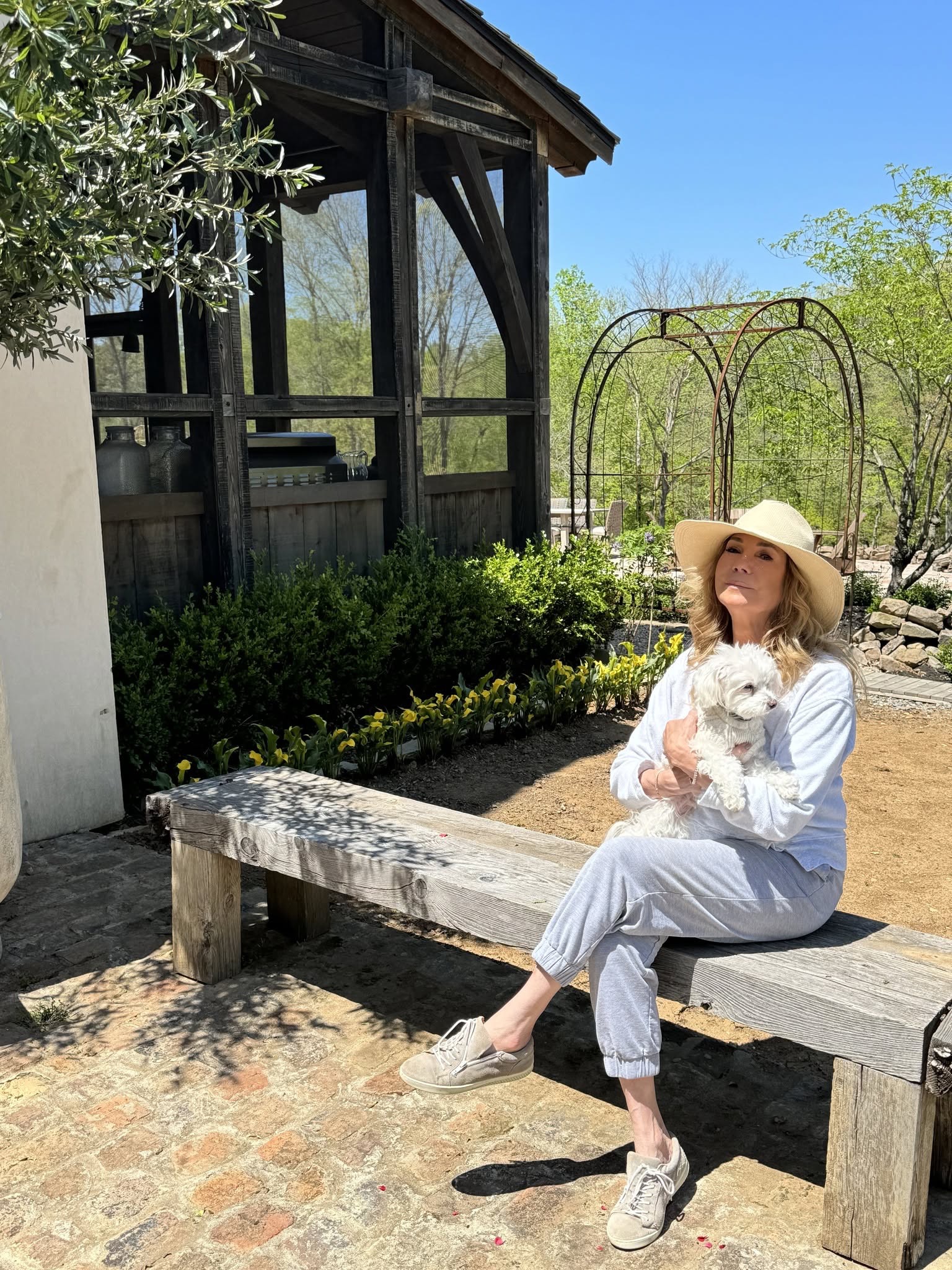 At her Nashville home, Kathie Lee enjoys quieter moments outdoors, surrounded by greenery and her beloved little dog — a peaceful change from her years in the television spotlight. | Source: Kathie Lee Gifford's Facebook.