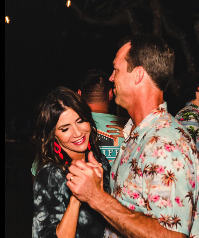 A quiet, intimate dance as Kristi Noem smiles with eyes closed as Bryon Noem leads, the moment lit by soft evening glow. | Source: Facebook/KristiNoem