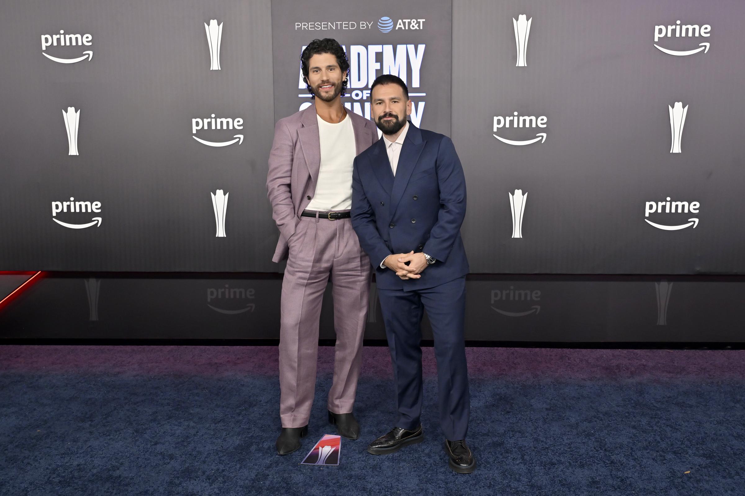 Dan Smyers and Shay Mooney bring contrasting suit styles to the ACM Awards red carpet on May 17, 2026 | Source: Getty Images