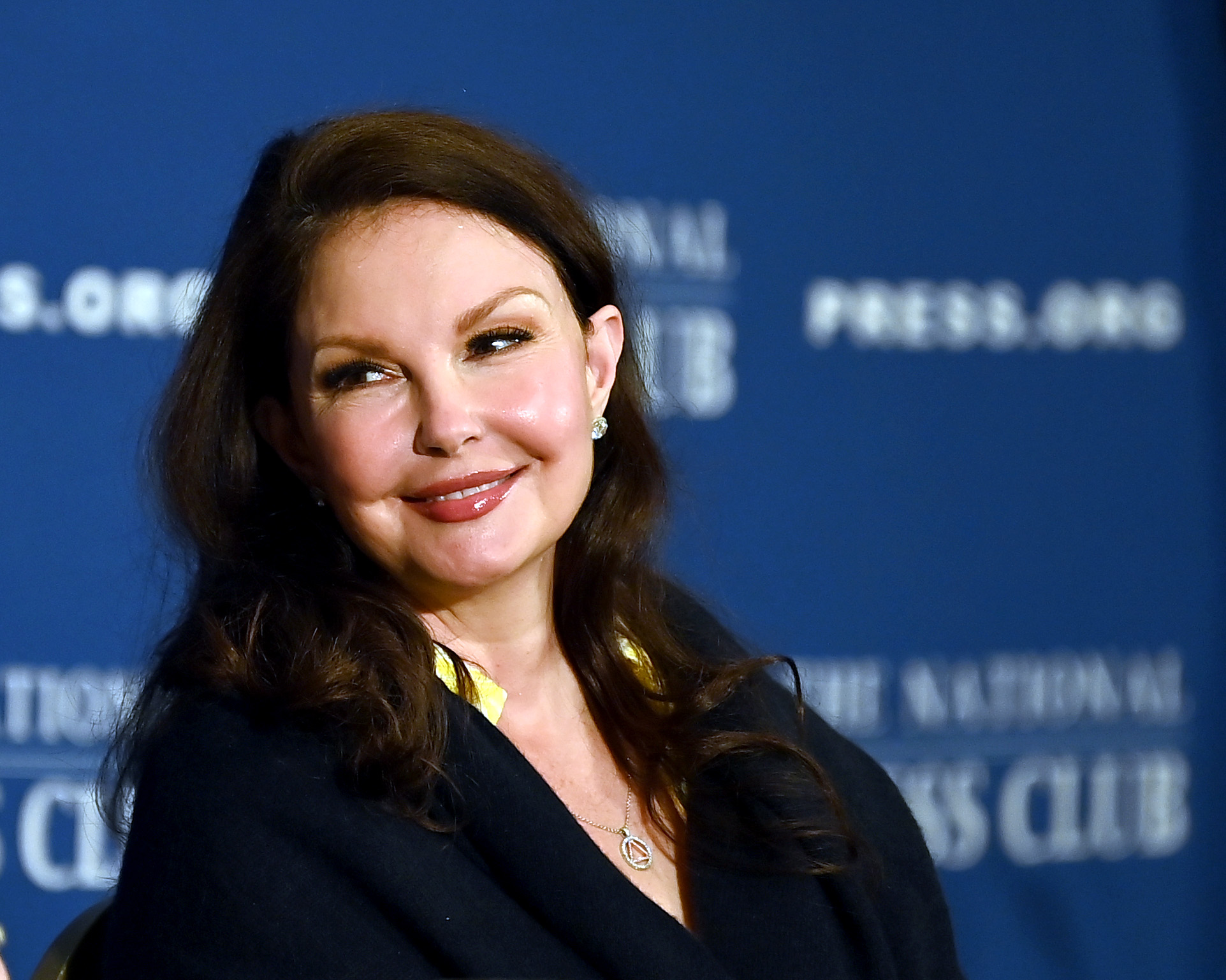 A May 2023 photograph shows Judd smiling at the National Press Club in Washington, D.C., with softly styled dark hair and visible lines around her eyes. She attended a discussion about responsible reporting on suicide, continuing her public advocacy amid ongoing interest in her appearance.