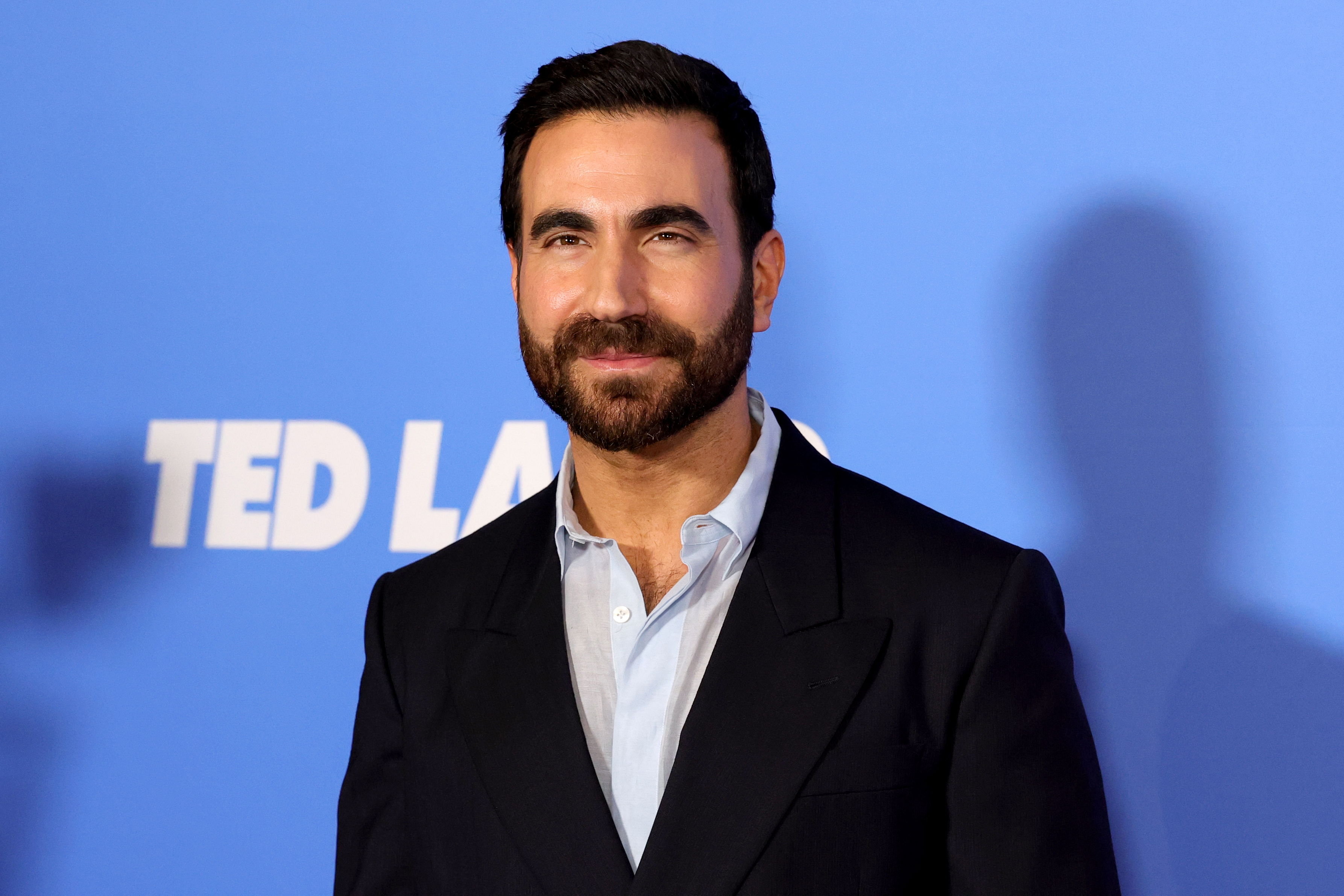 Brett Goldstein poses at the "Ted Lasso" Season 4 premiere in New York City on August 4, 2026. His dark hair and full beard are among the features visible in the photo as social media users debate his resemblance to Ben Affleck. | Source: Getty Images
