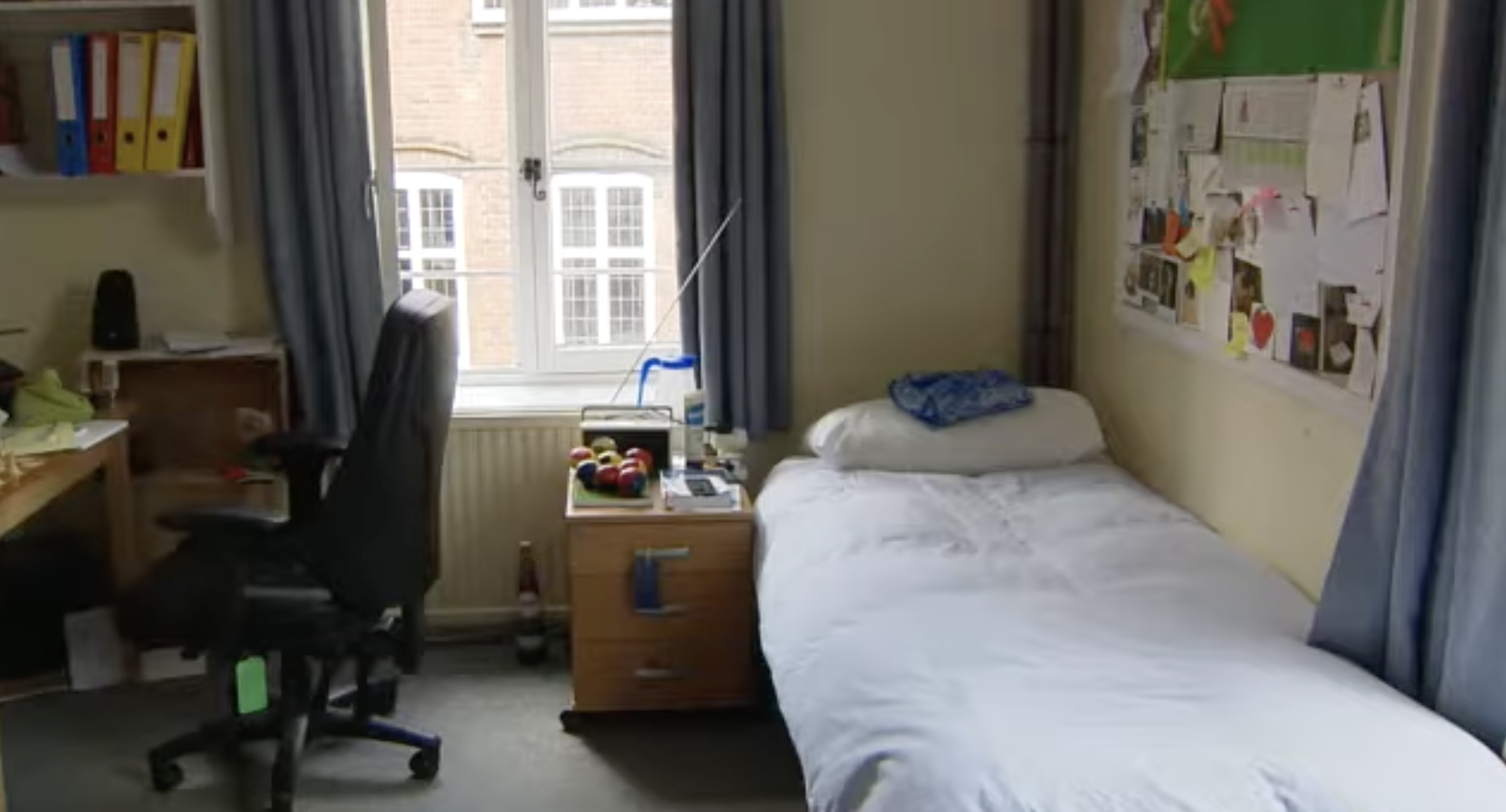 A student bedroom at Eton College features a single bed, study desk, and personal noticeboard. The school's prospectus states that each boy has his own study-bedroom. | Source: Youtube/Paradoxyy