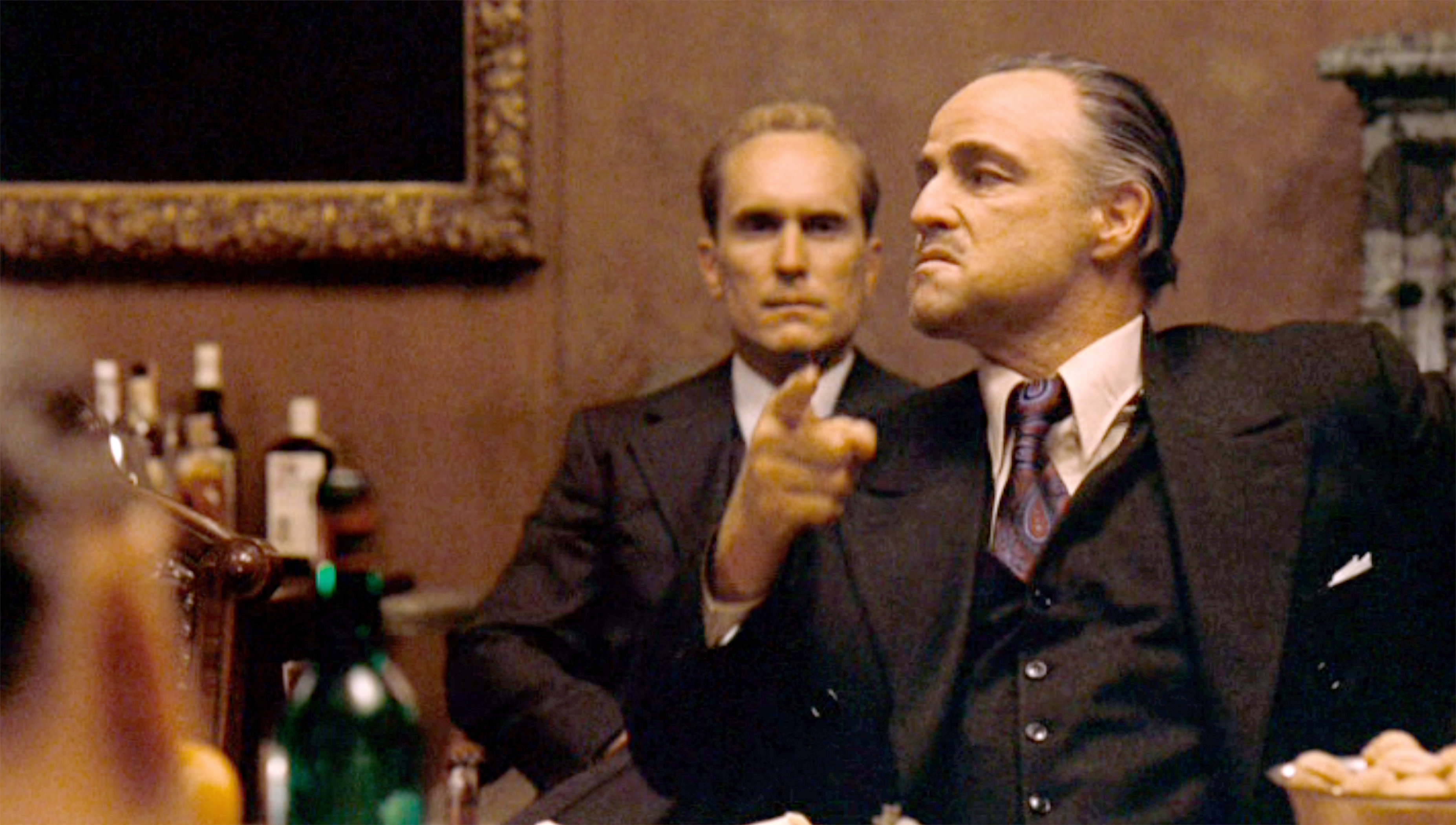Robert Duvall as Tom Hagen and Marlon Brando as Don Vito Corleone in "The Godfather" on March 15, 1972. | Source: Getty Images