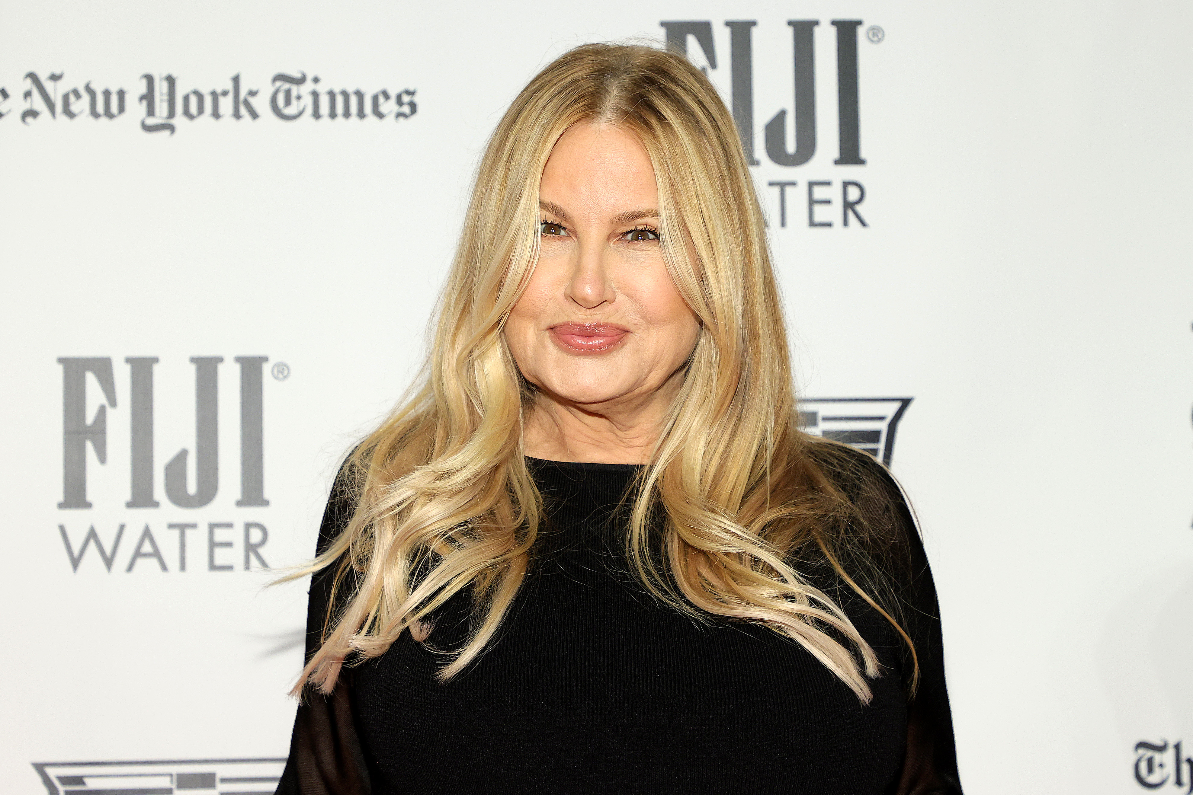 Jennifer Coolidge at the Gotham Awards in New York City, posing against a branded backdrop | Source: Getty Images