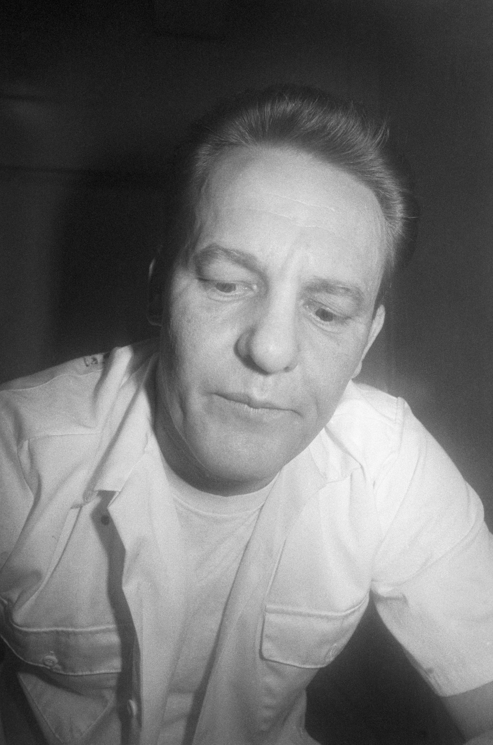 Charles V. Harrelson talks with the press from a jail visitor's room, circa 1980s. | Source: Getty Images