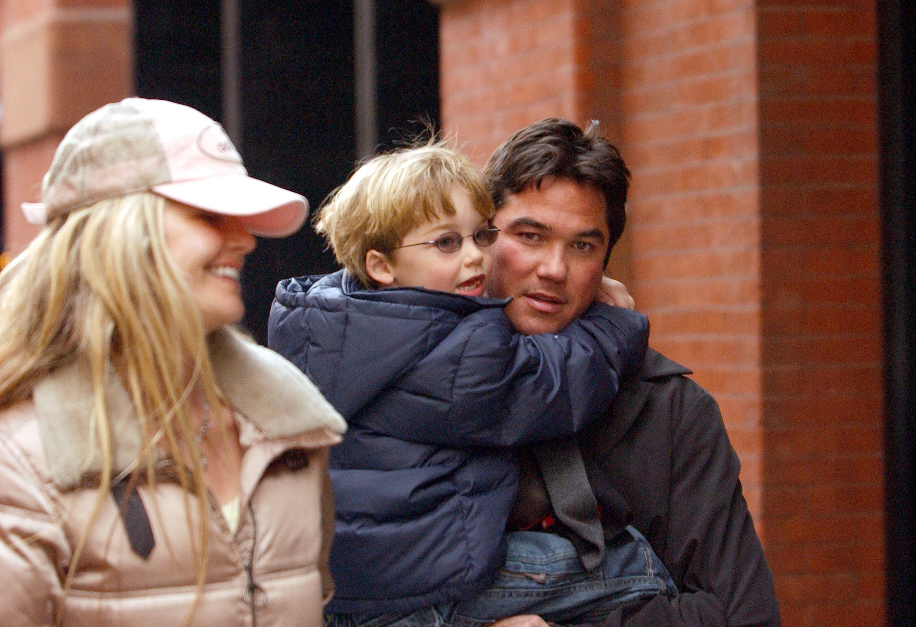 Dean Cain carried Christopher while walking in New York City with Samantha Torres in March 2005. Dean and Torres initially shared custody of their son before agreeing in 2011 that Dean would assume sole custody. | Source: Getty Images
