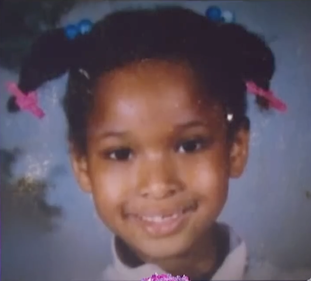 The actress smiles during a childhood school portrait | Source: Youtube/JenniferHudsonShow