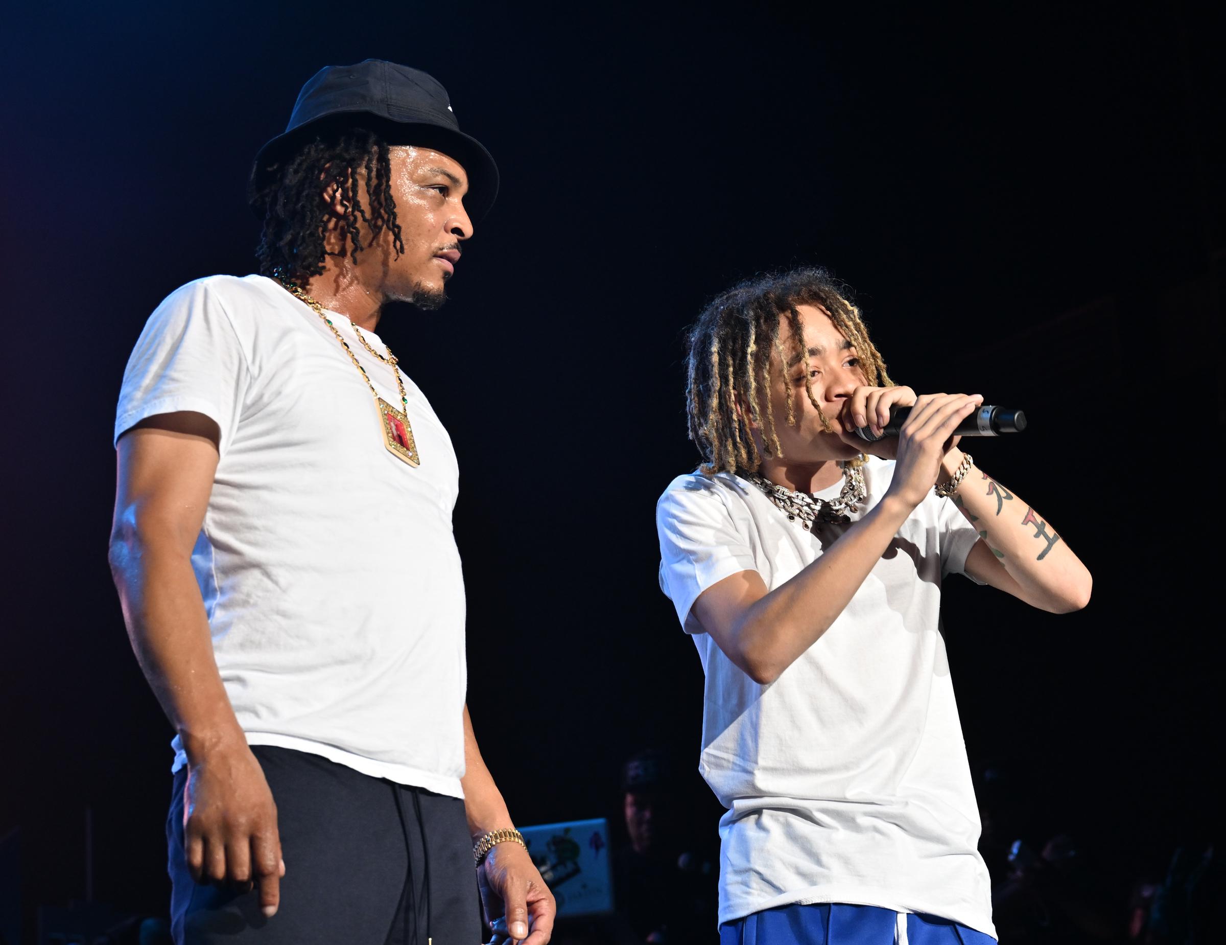 T.I. stands alongside King Harris as he performs live at the ATL Hip-Hop 50 concert in Atlanta, Georgia, on August 13, 2023 | Source: Getty Images