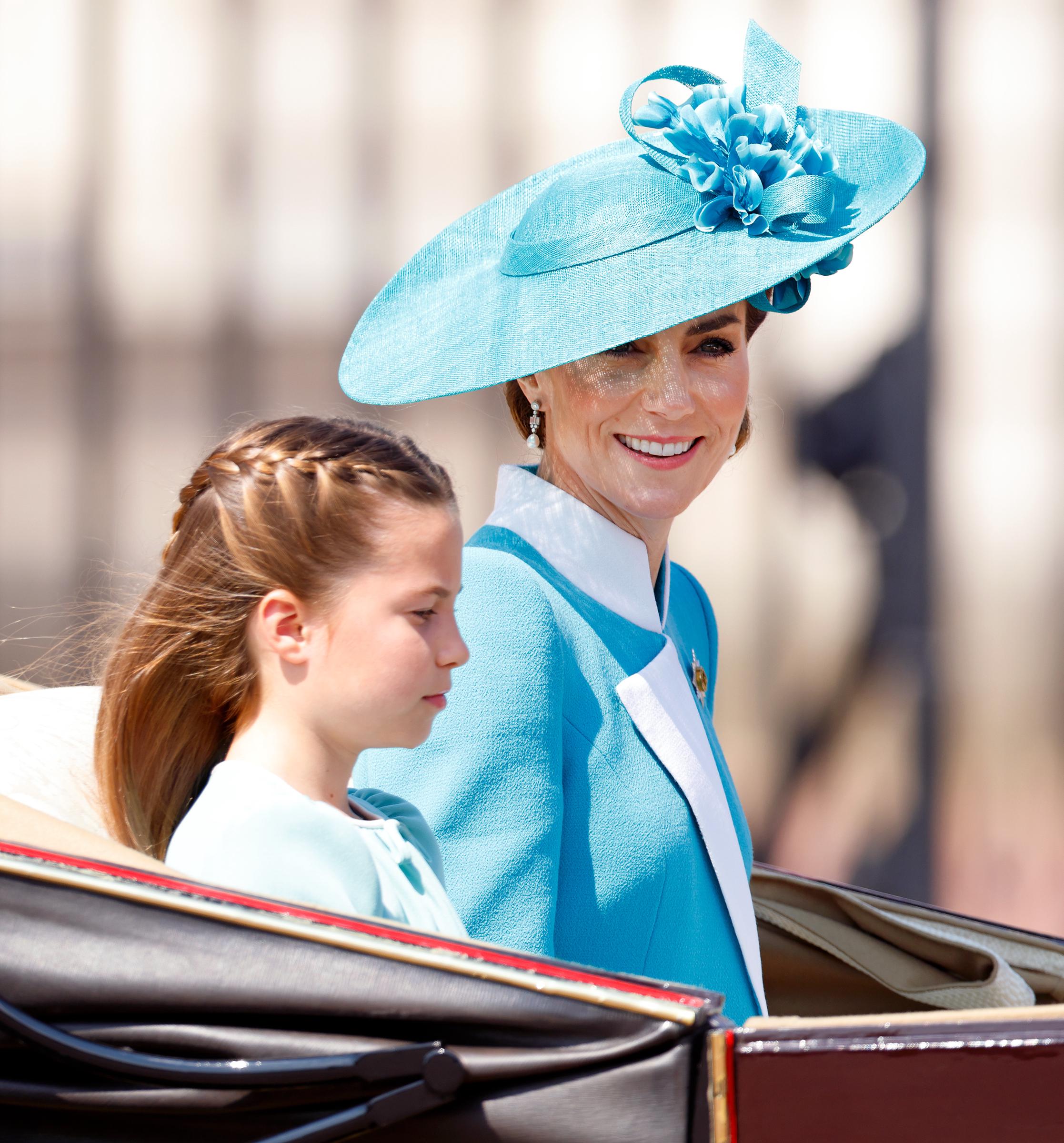 Catherine, Princess of Wales looks radiant seated next to Princess Charlotte on the carriage. The duo's striking resemblance has social media buzzing.