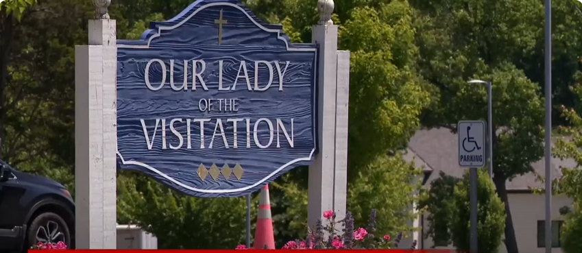 The sign post of Our Lady of Visitation Parish in Green Township | Source: YouTube/@Dayton247Now