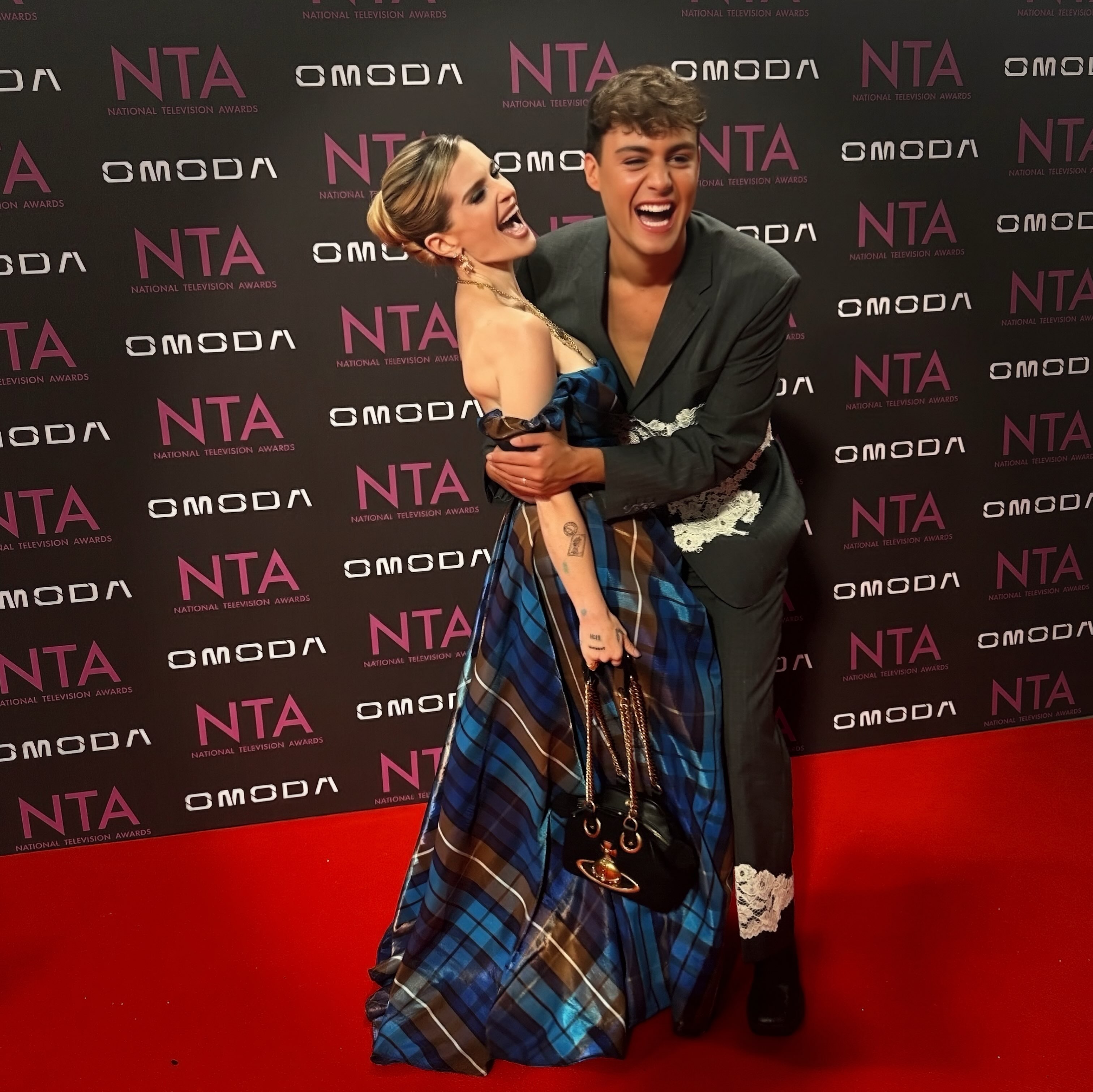 Kelly shares an unfiltered moment of laughter on the NTA red carpet while leaning on her date for the evening, Bradley Riches. | Source: Instagram/kellyosbourne